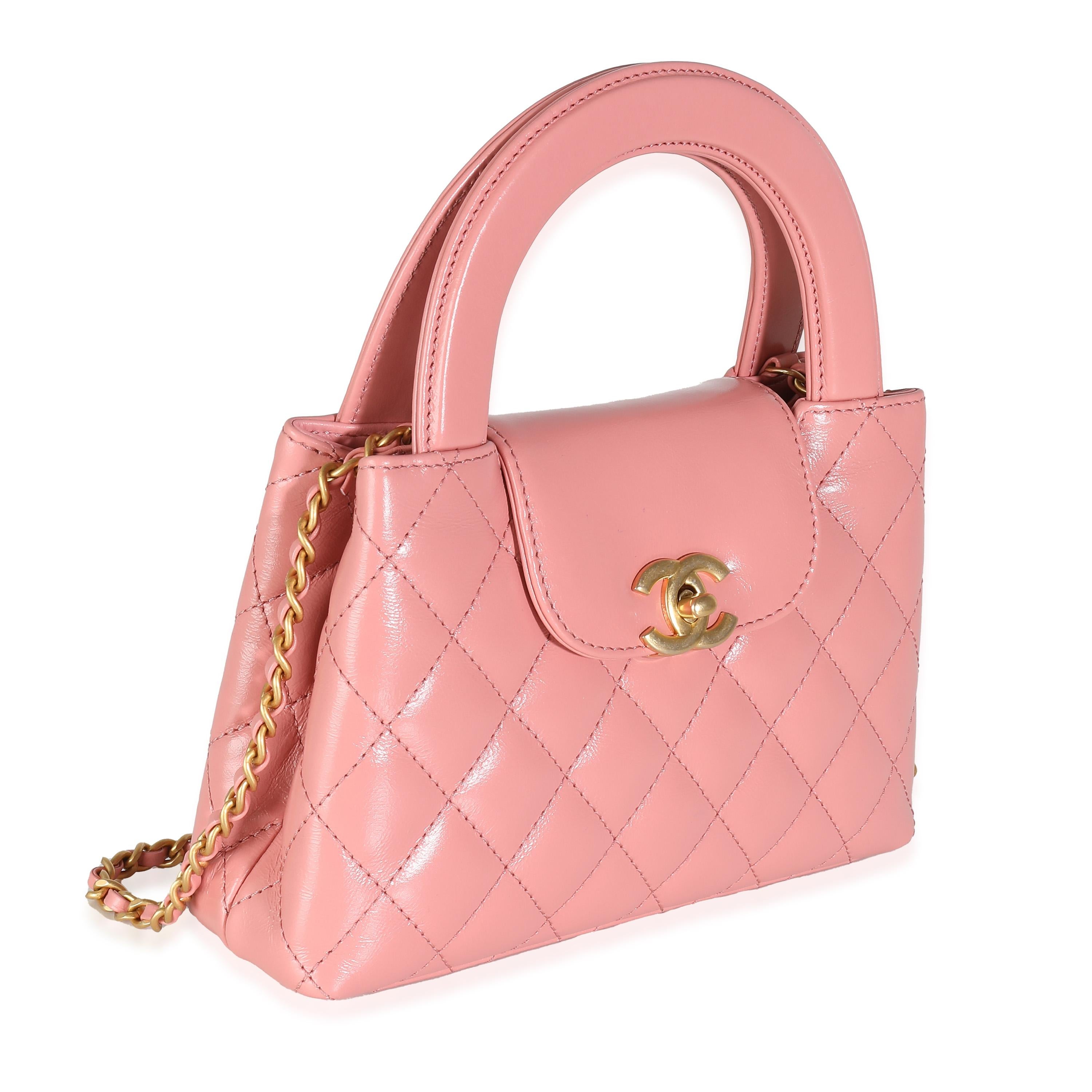 Listing Title: Chanel Pink Shiny Aged Calfskin Quilted Nano Kelly Shopper
SKU: 139858
Condition: Pre-owned 
Handbag Condition: Excellent
Condition Comments: Item is in excellent condition and displays light signs of wear. Light mark along exterior