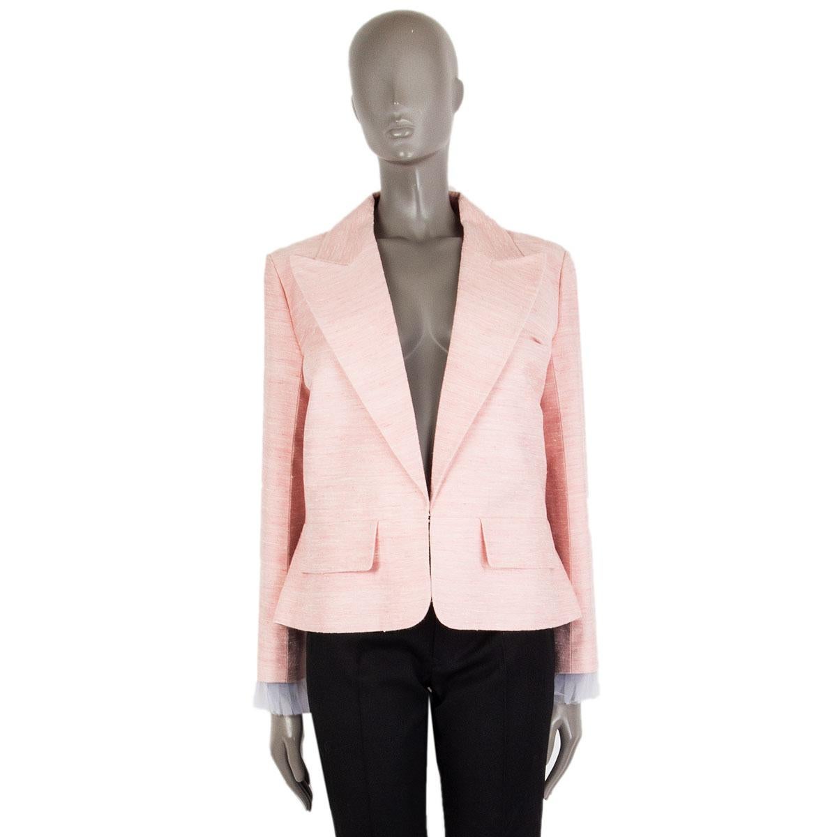 authentic Chanel 'Paris-Cuba' peak-collar blazer in baby pink silk duping (100%). With two flap pockets on the front, back slit, signature chain around the inside of the hemline, and detachable pleated cuffs in off-white polyester tulle (100%).