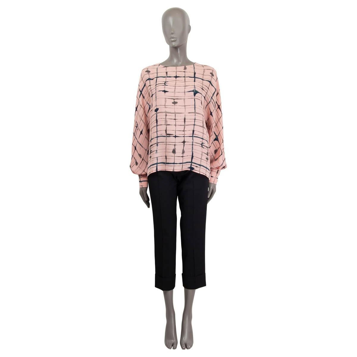 100% authentic CChanel 2021 oversized printed blouse in light pink, navy blue and faded black silk (100%). Opens with four golden star embellished buttons on the back. The design features wide raglan sleeves, is unlined and comes with buttoned