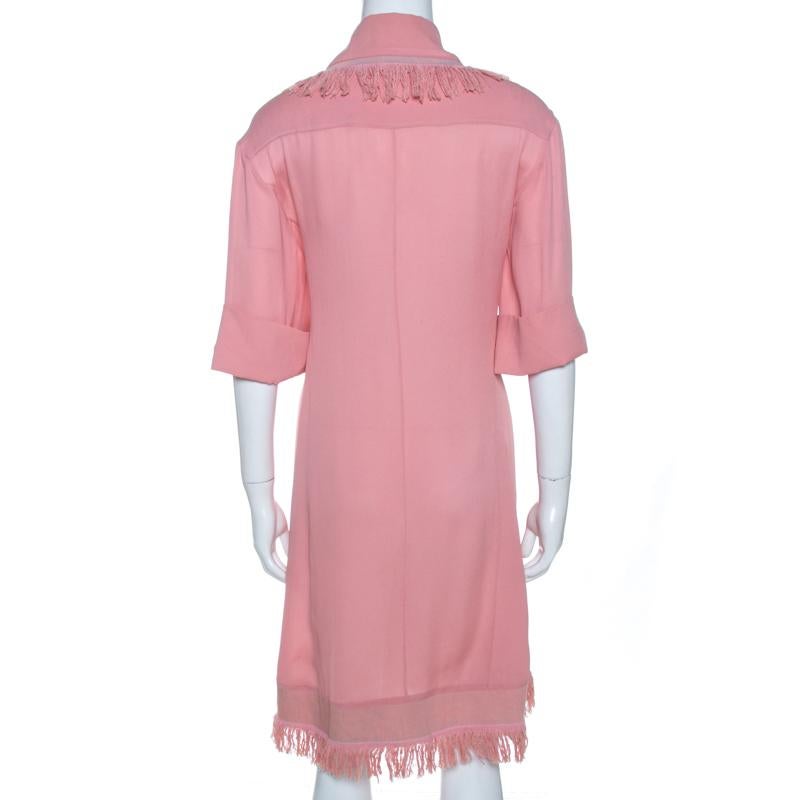 Chanel is known for its sophisticated and timeless designs and this shift dress is no different. Crafted meticulously with 100% silk, this luxurious creation comes in a lovely shade of pink. It is designed to deliver effortless style and is a closet