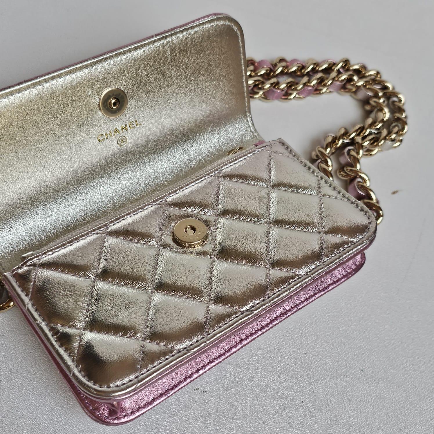 Metallic iridescent wallet on chain in great condition. Can be crossbody but the strap is a little short. Series 31. Comes with card and dust bag.