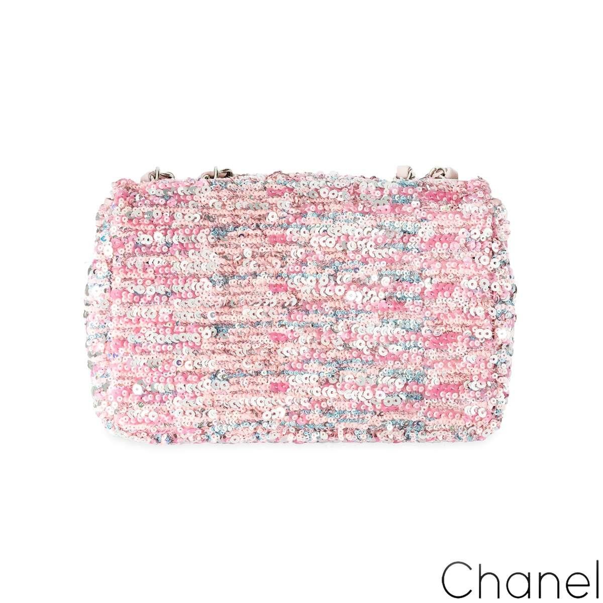 A stunning Chanel classic flap handbag from Chanel's 2023 Spring-Summer Classics collection. The exterior of this mini flap is crafted in pink and silver sequins with silver-tone hardware. It features a front flap with signature CC turnlock closure