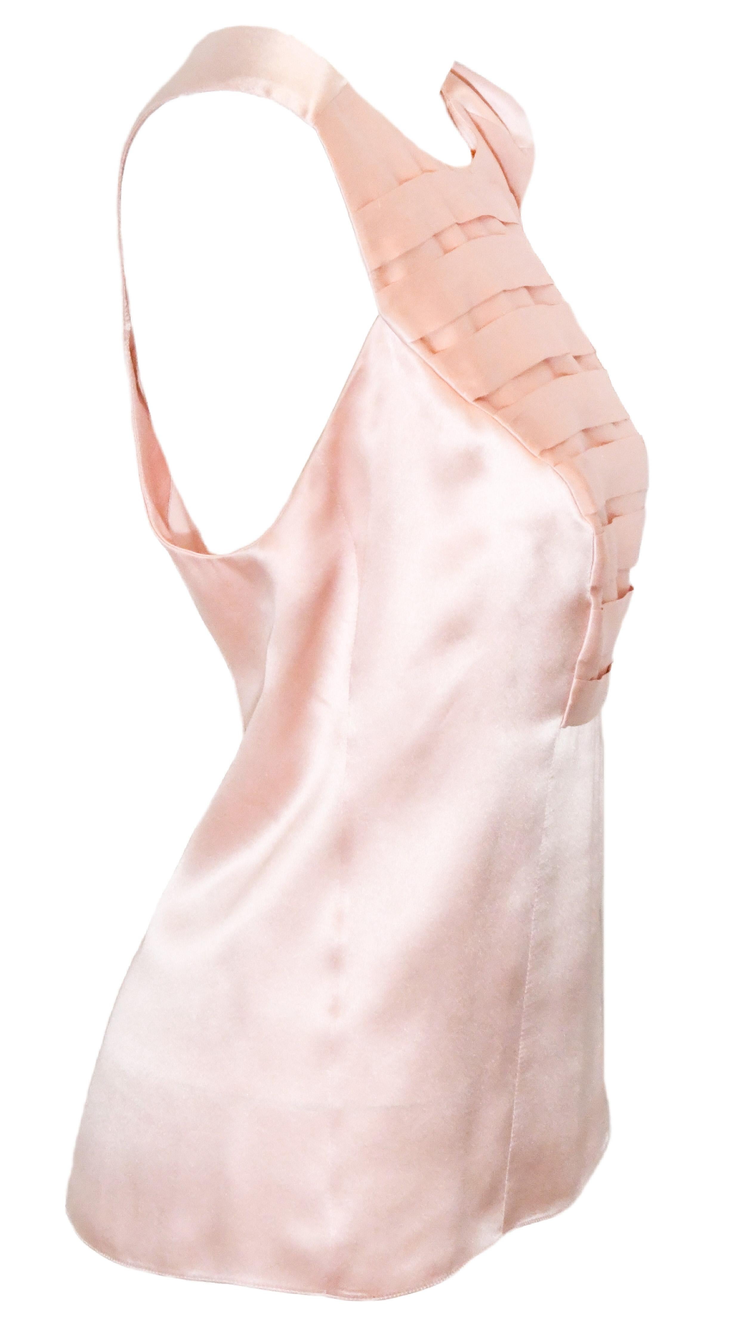 Chanel pink sleeveless horizontal pleated silk top includes at back zipper for closure.  This top is not lined.  It is in excellent condition.  Made in France