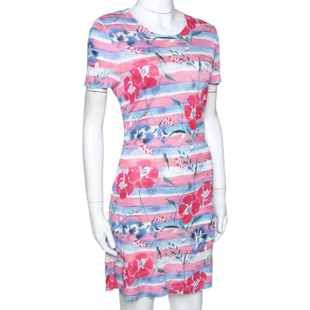 Stylish, playful and perfect for vacations, this shift dress from Chanel is a must-have. Crafted from quality materials, it has been cut simply. It carries a pink striped and floral print that adds interest. It has a round neck, short sleeves,