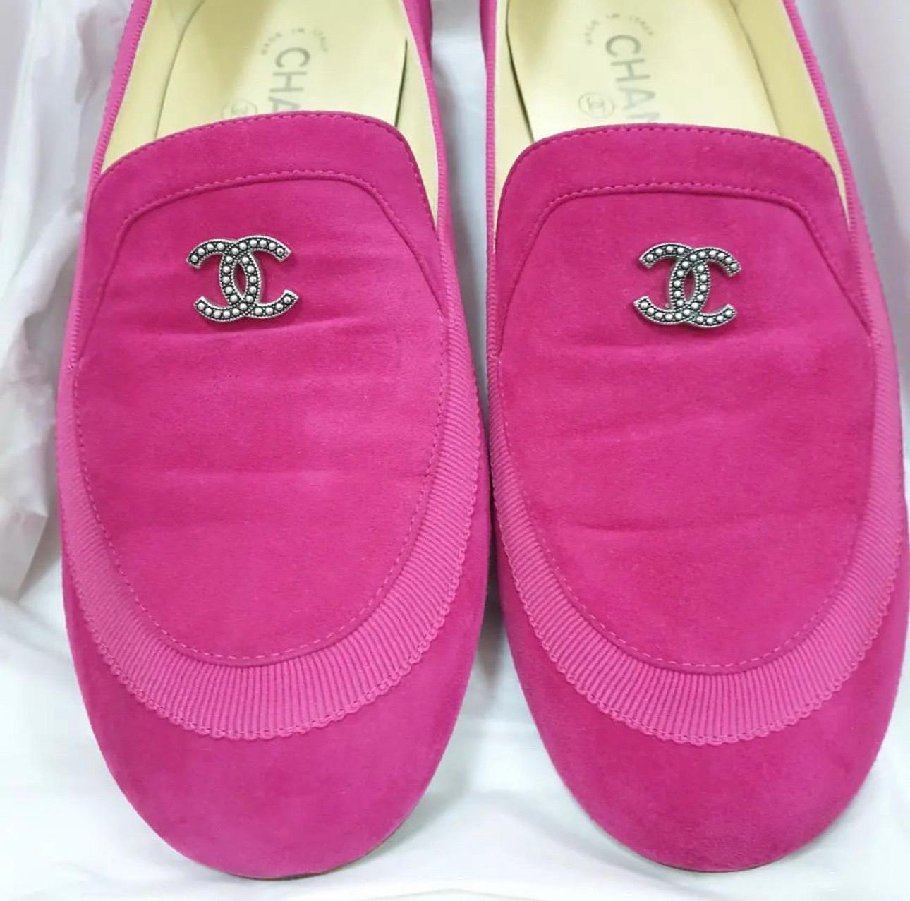 Right on style and comfort, this pair of loafers by Chanel will make a great addition to your shoe collection.
They've been crafted from quality suede and they feature the CC logo on the uppers. 
Leather insoles, silver-tone hardware and tough