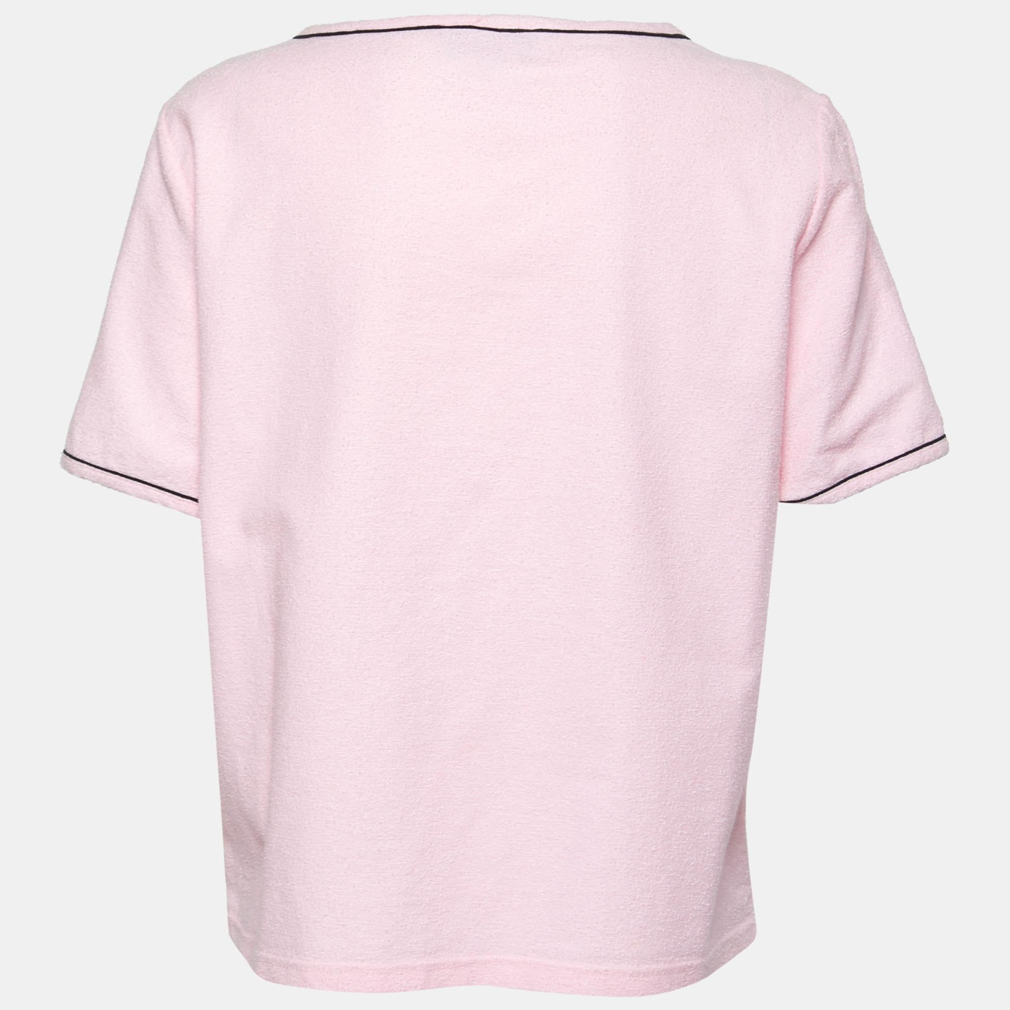 This T-shirt from Chanel is all about sporting a classy and comfy style. It is tailored from pink terry knit fabric, which is augmented with logo detailing on the front. It displays short sleeves. This T-shirt is great for casual use and will make