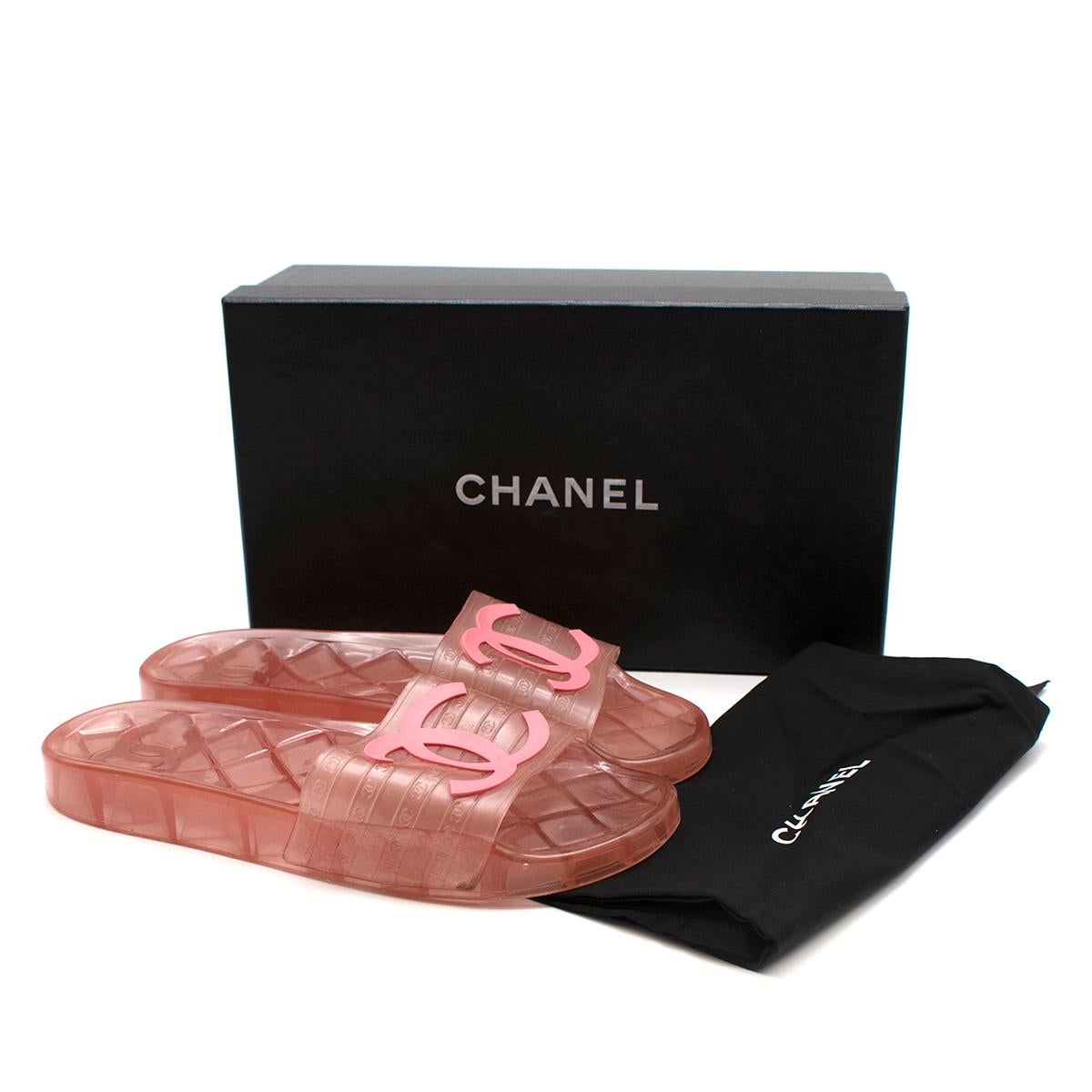 Chanel Pink Translucent CC Slide Sandals  

- Classic slide style 
- Legendary CC logo to the front 
- Soft pink hue
- Translucent effect 
- Quilted like texture to the soles 
- Original box and dust bag
- Versatile practical design
