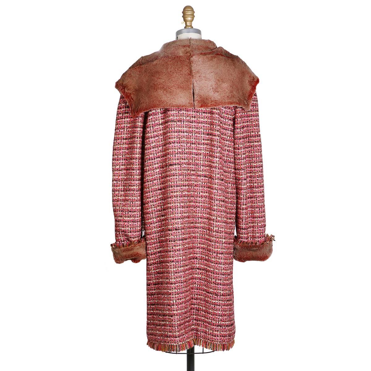 Coat by Chanel from Fall 2001
Pink tweed with rabbit fir trim, collar, and lining
Frayed hem
Condition: Excellent
Size/Measurements:
Size 40
40
