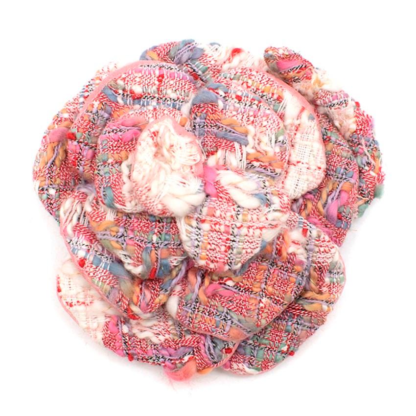 Chanel Pink Tweed Camellia Brooch

- Signature camellia flower with stem
- White, pink and blue tweed
- Stem is adjustable
- Pink silk backing
- Silver tone push pin closure

Please note, these items are pre-owned and may show signs of being stored