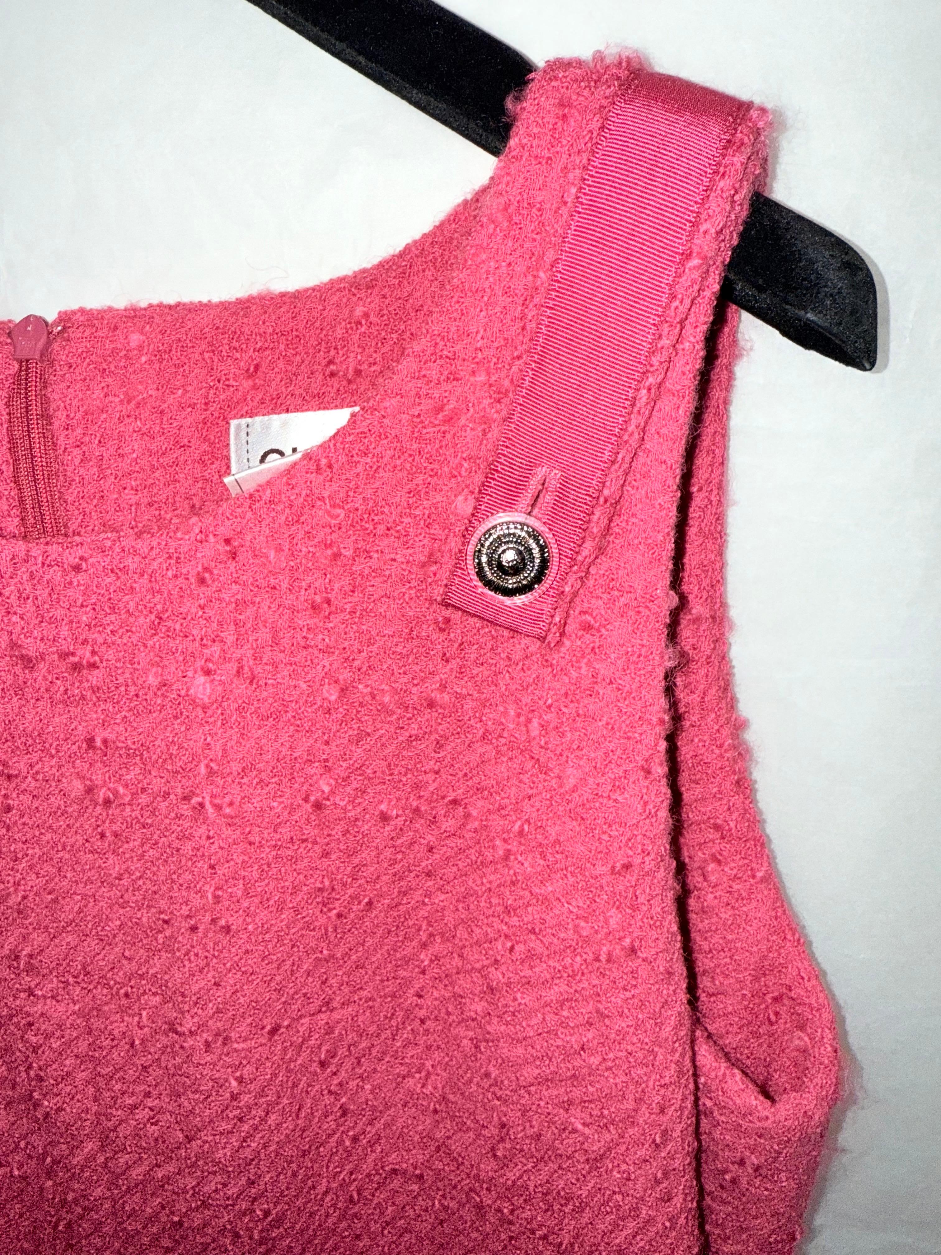 - Chanel pink tweed dress.

- CC button on the strap.

- Detachable shoulder strap.

- Double Vent at the back.

- Size 42.

- Shoulder to Shoulder: 14 inches.
Bust: around 40 inches.
Waist: around 38 inches.
Length: around 41 inches long.
