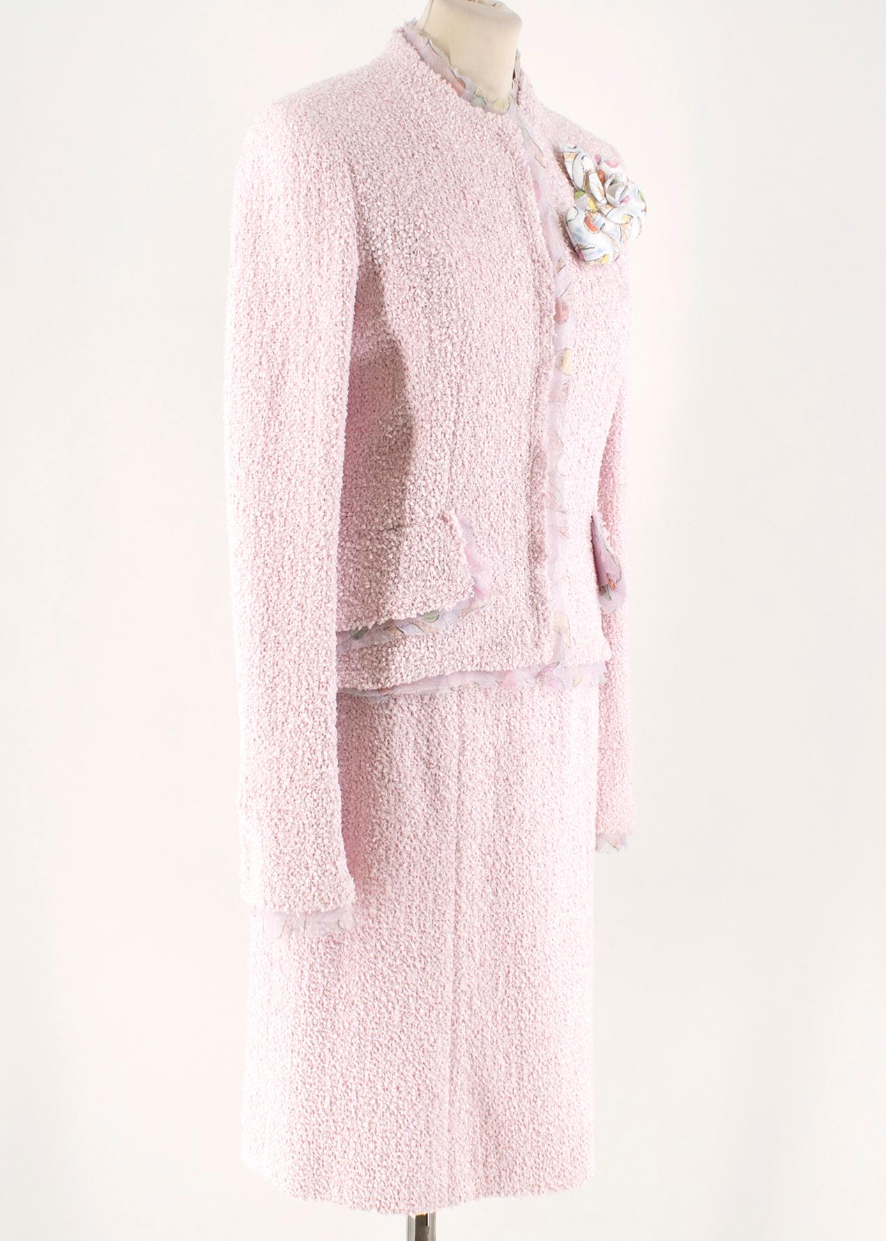 Chanel Pink Tweed Skirt Suit W/ Ice Cream Print Trim & Camellia 

Jacket 
- Pink Tweed Jacket
- Round neck, long sleeved 
- Buttoned down center front with CC logo print
- Multi color print silk raw trim hems around neck, center front, pockets and 