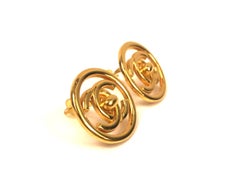 Chanel plated gold turn lock "CC" logo round clip on earrings