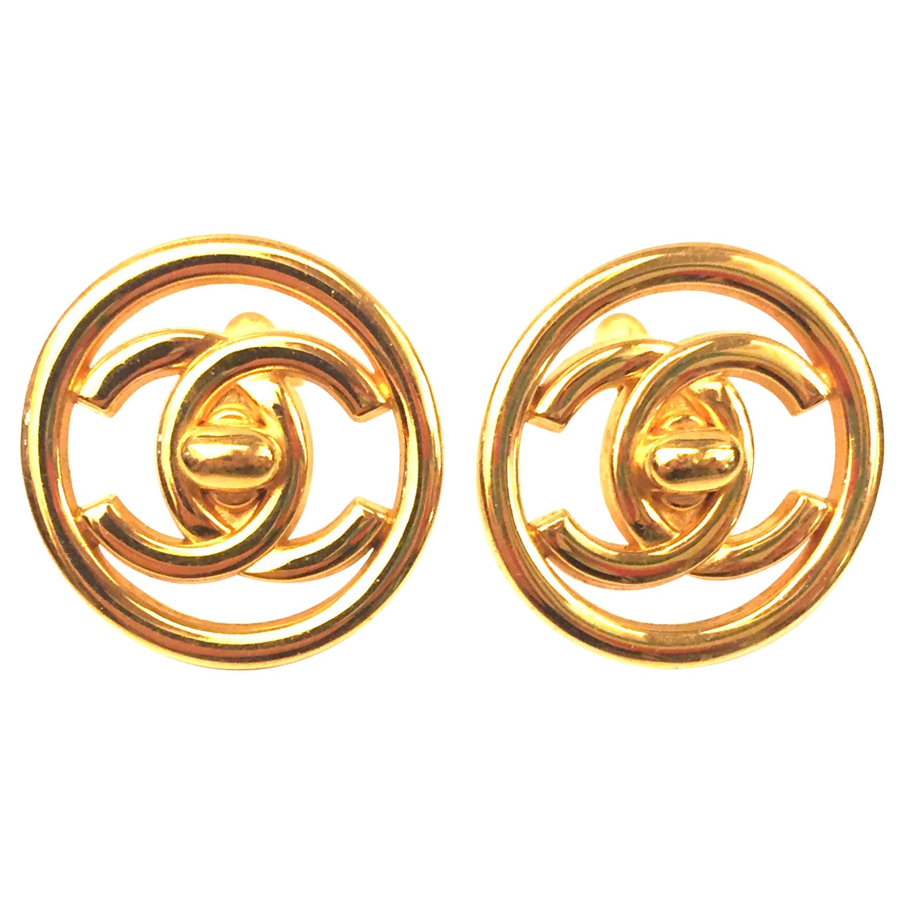 Chanel plated gold turn lock "CC" logo round clip on earrings 