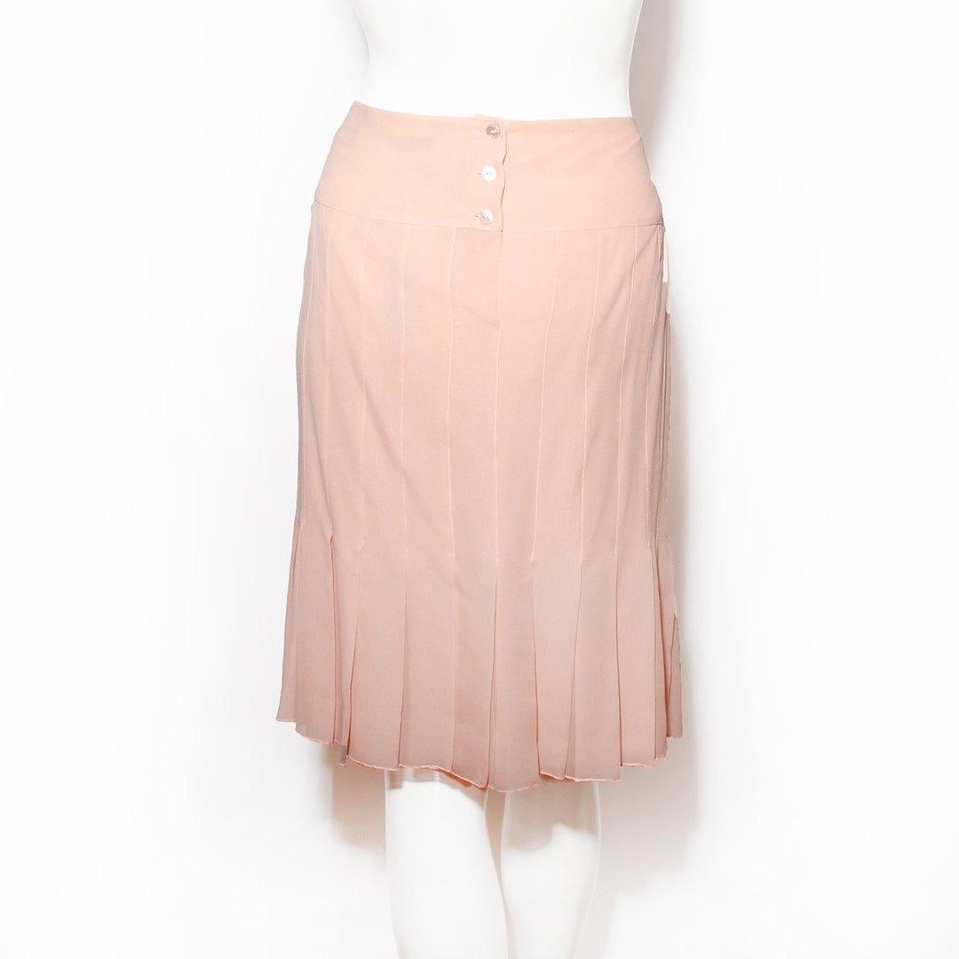 Pleated skirt by Chanel 
Fall/winter 2003 RTW collection
Pink color 
Button back closure 
High waist
100% silk
Made in France
Condition: Excellent, like new. Tags still attached. (see photos)
Size/Measurements: (approximate, taken flat) 
Size 44
32