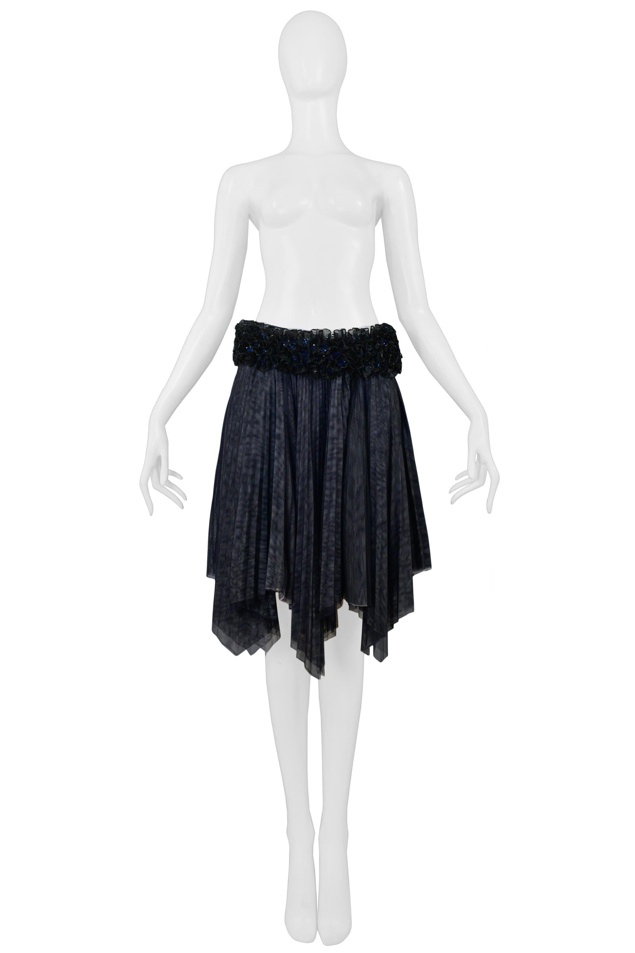 Resurrection Vintage is excited to offer a vintage Chanel by Karl Lagerfeld black pleated evening skirt featuring decorative black mesh flowers and rhinestone beaded waistband, top black layer and off white underlayer, sharp pleats, asymmetrical