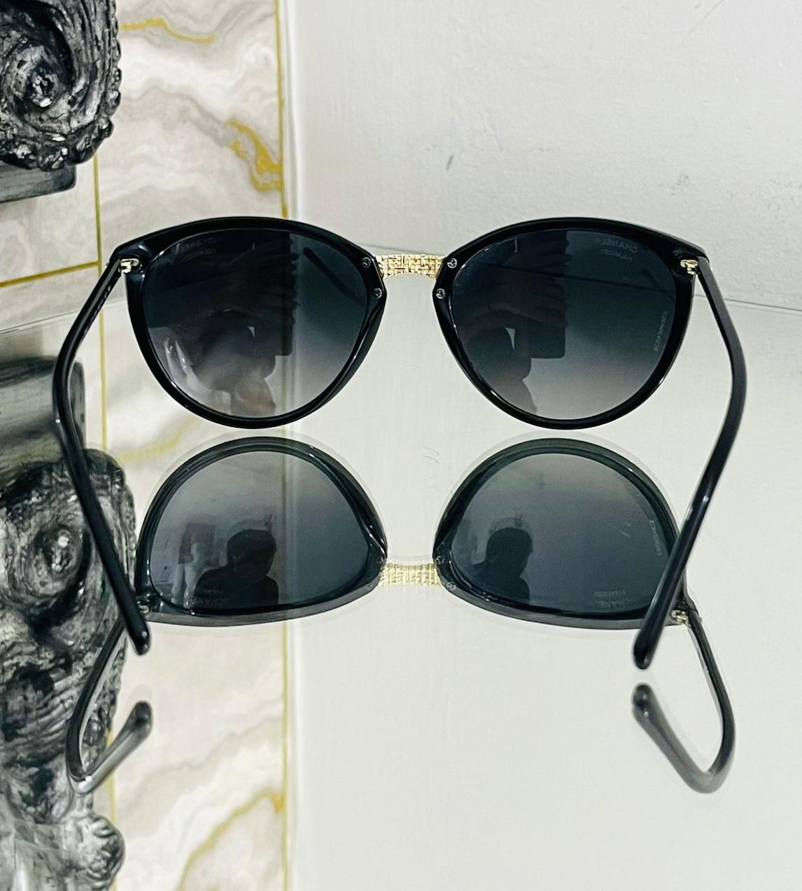 Chanel Polarised Butterfly Sunglasses

Black framed sunglasses designed with black lenses.

Detailed with gold decorative bridge and 'CC' logo at the temple on each side.

Polarized sunglasses are ideal for winter, they help to reduce the glare,
