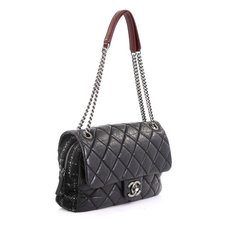 This Chanel Portobello Flap Bag Quilted Aged Calfskin with Tweed Jumbo, crafted from black quilted aged calfskin leather, features chain link straps with leather pads and aged silver-tone hardware. Its CC boy push-lock closure opens to a red fabric