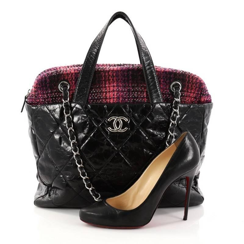 This authentic Chanel Portobello Zip Tote Quilted Glazed Calfskin and Tweed is a luxurious bag perfect for everyday use. Crafted from black quilted glazed calfskin with purple tweed, this bag features dual-flat leather handles, woven-in leather