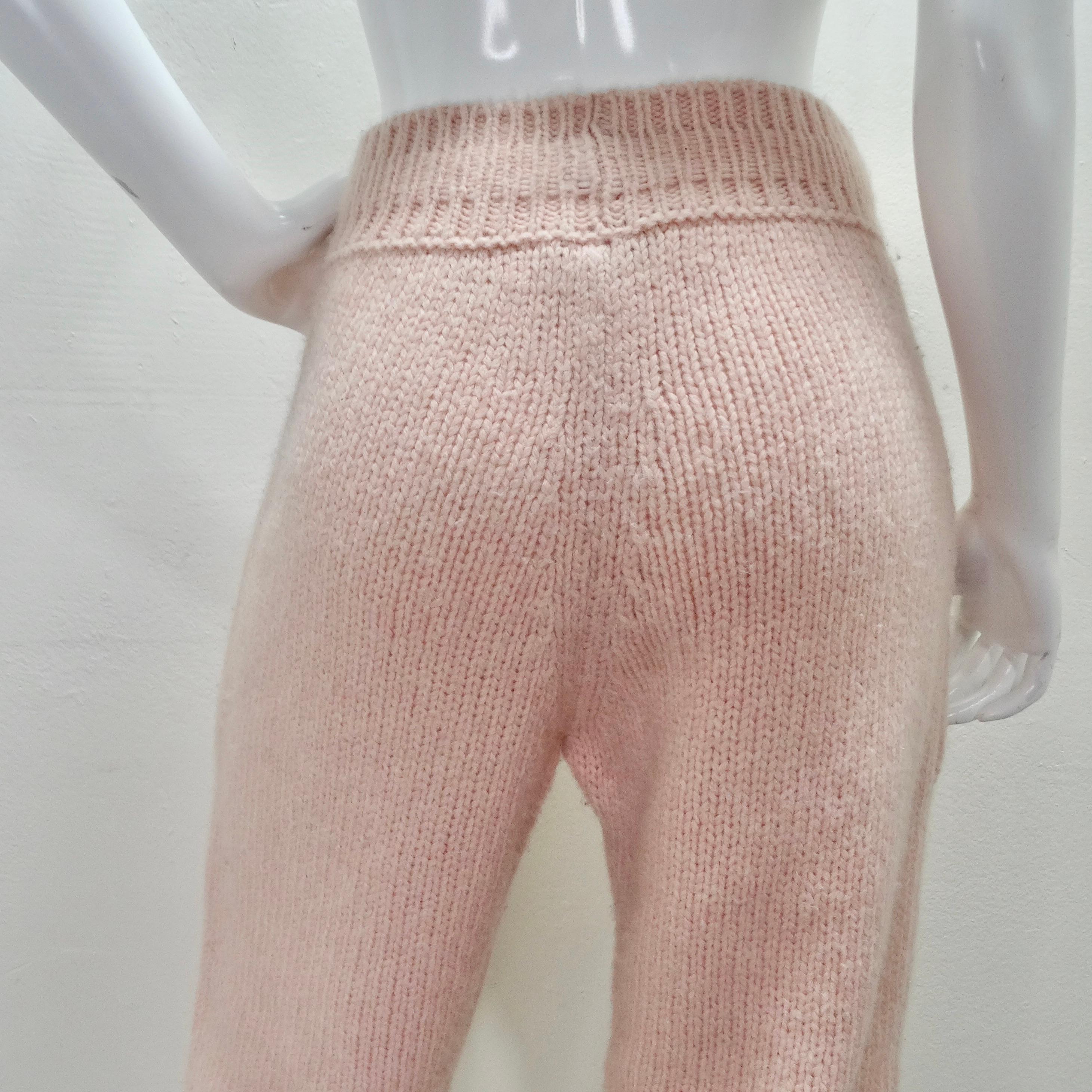 Do not miss out on the Chanel Pre Fall 2021 Pink Alpaca Knit Jogger Sweatpants, a blend of comfort, practicality, and subtle luxury that embodies Chanel's timeless elegance. These jogger-style sweatpants are crafted from a cozy alpaca knit in a