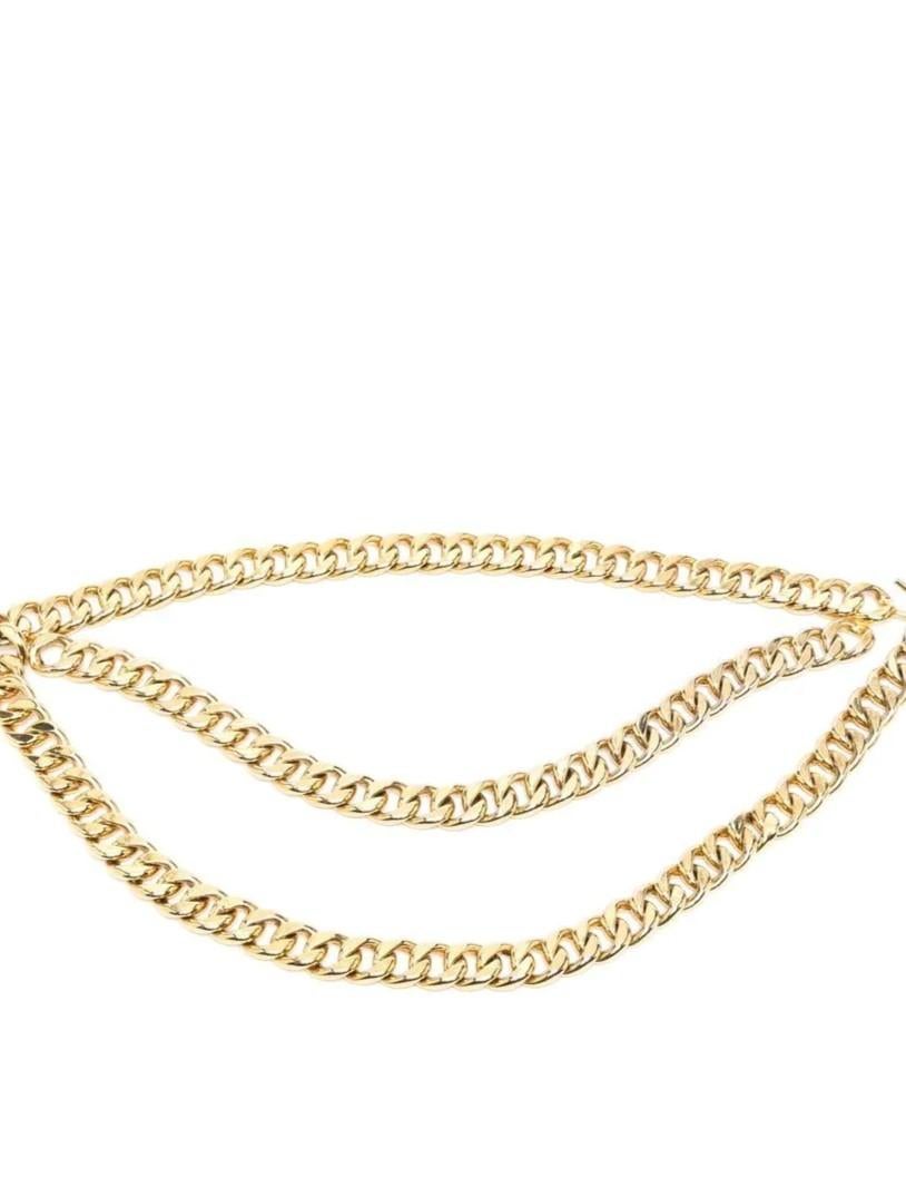 This gold-plated Chanel belt is the perfect addition to any look. Simple, yet classic and glamorous, this style features polished gold-plated metal, a chunky chain-link construction, and is adorned with two charms. The hook fastening is easy and