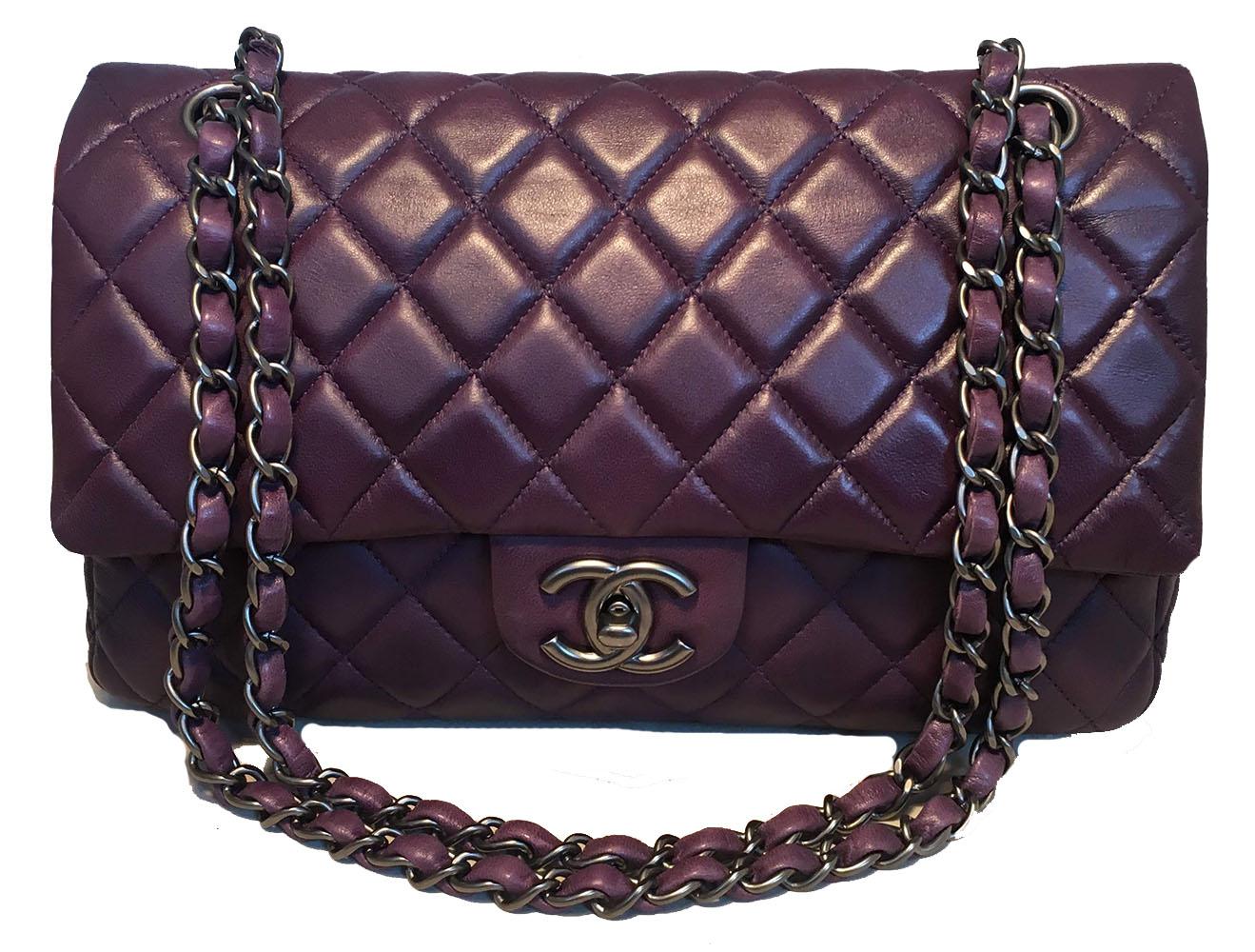 Chanel Purple 10 inch 2.55 Double Flap Classic Shoulder Bag in excellent condition. Purple quilted lambskin leather exterior trimmed with matte silver hardware. Signature woven chain and leather shoulder strap and twisting CC logo front closure.