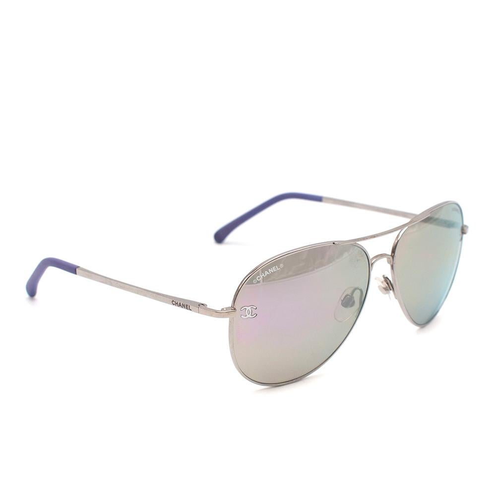 Chanel Purple and Silver Pilot Sunglasses

- Purple gradient mirror lenses
- 4189TQ
- Silver metal pieces
- Signature CC on lenses
- Aviator style
- Leather earpiece caps

Materials:
Metal and calfskin

Made in Italy

