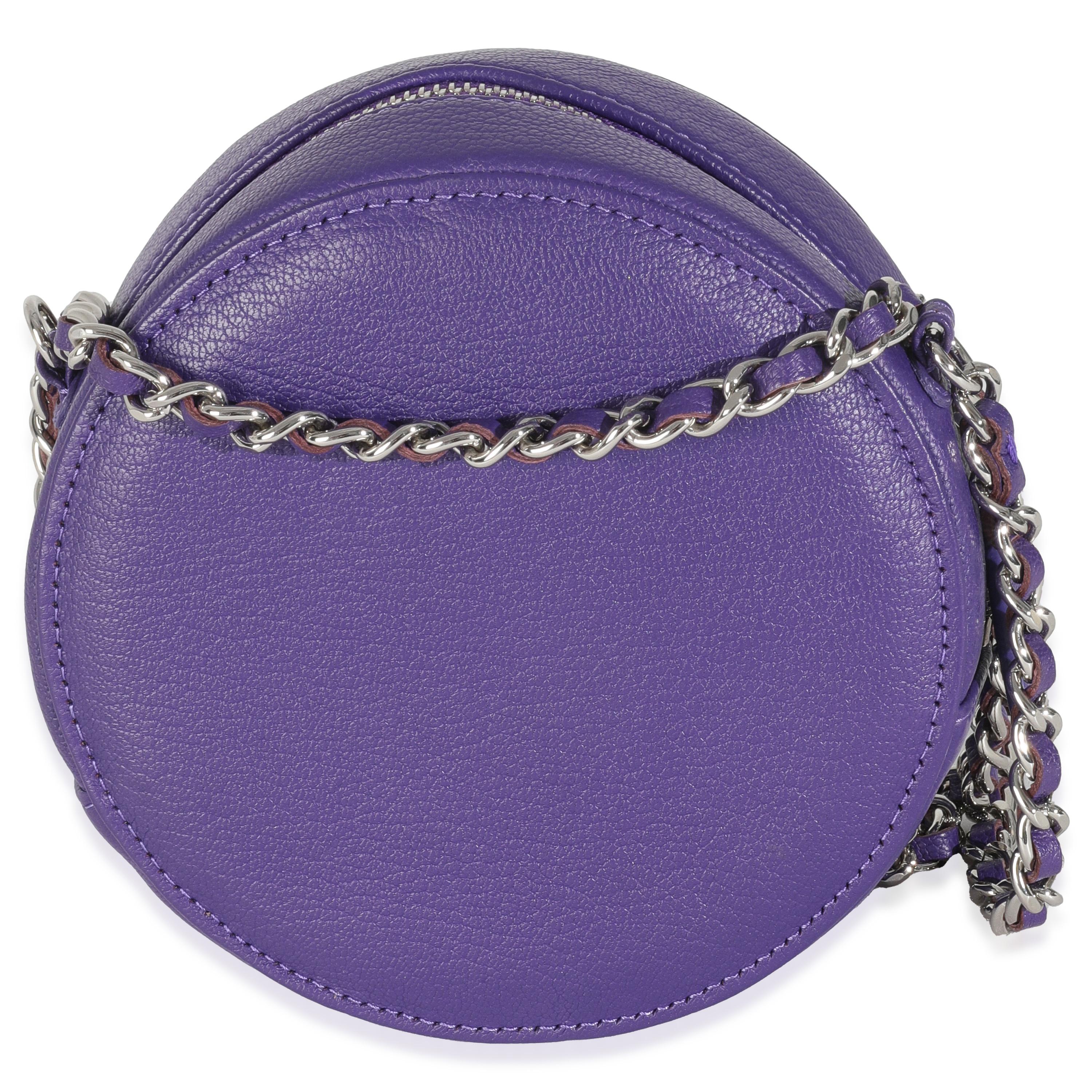 Listing Title: Chanel Purple Calfskin Ski Round Clutch With Chain
SKU: 146656
Condition: Pre-owned 
Handbag Condition: Excellent
Condition Comments: Item is in excellent condition and displays light signs of wear. Faint pressmarks along