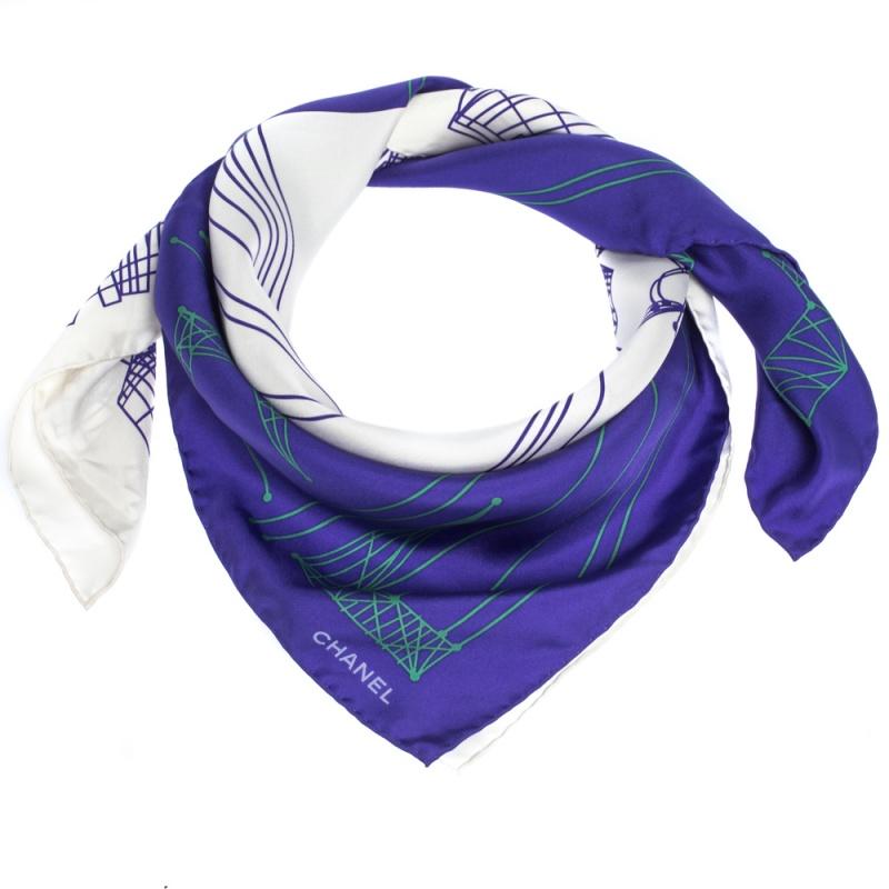 When you really love to accessorize then do not forget this casual, purple colorblock scarf fabricated from smooth silk. Chanel has designed this scarf with an interesting graphic print and the logo design.

