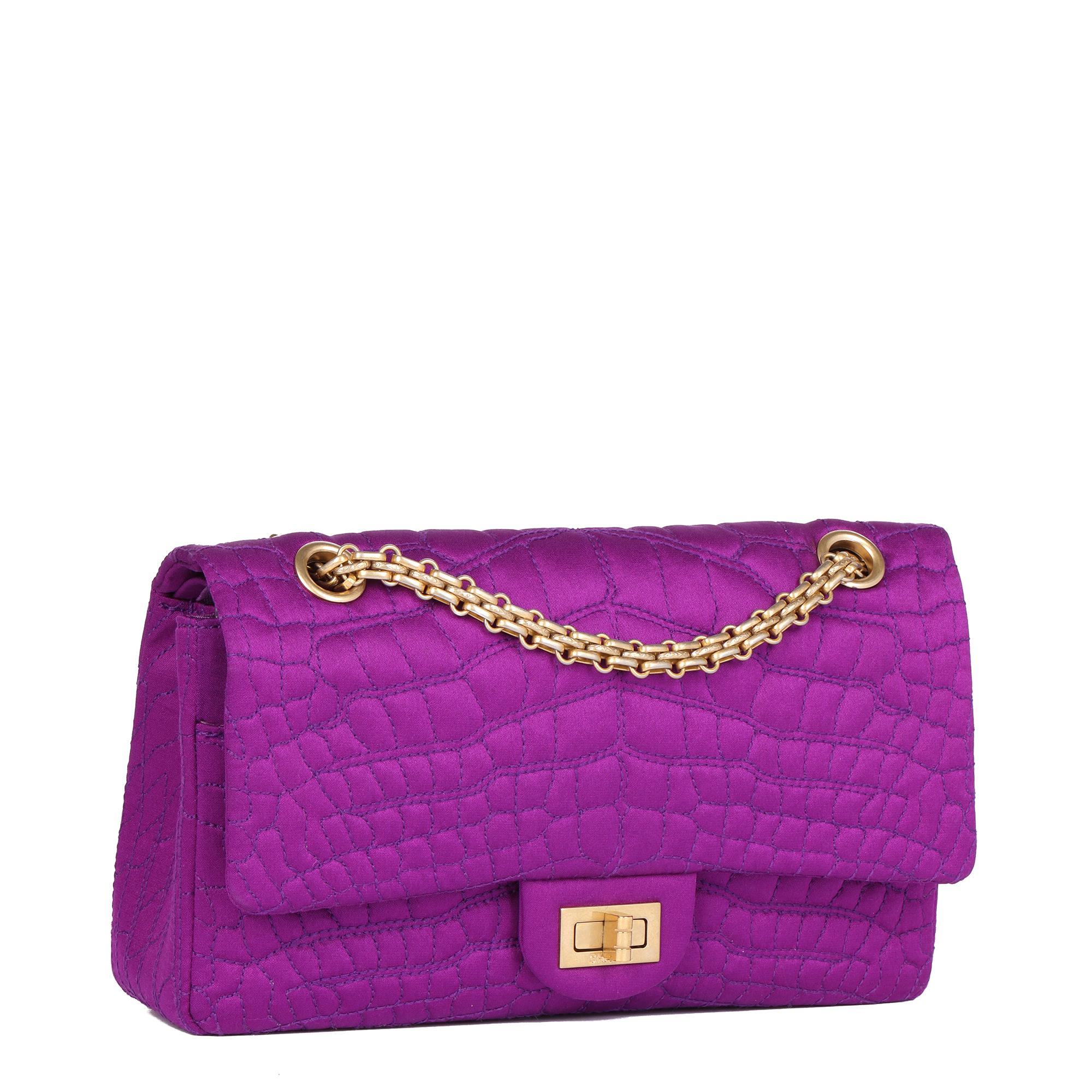 CHANEL
Purple Crocodile Embroidered Satin 2.55 224 Reissue Double Flap Bag

Xupes Reference: CB762
Serial Number: 11852329
Age (Circa): 2006
Accompanied By: Chanel Dust Bag, Authenticity Card
Authenticity Details: Authenticity Card, Serial Sticker