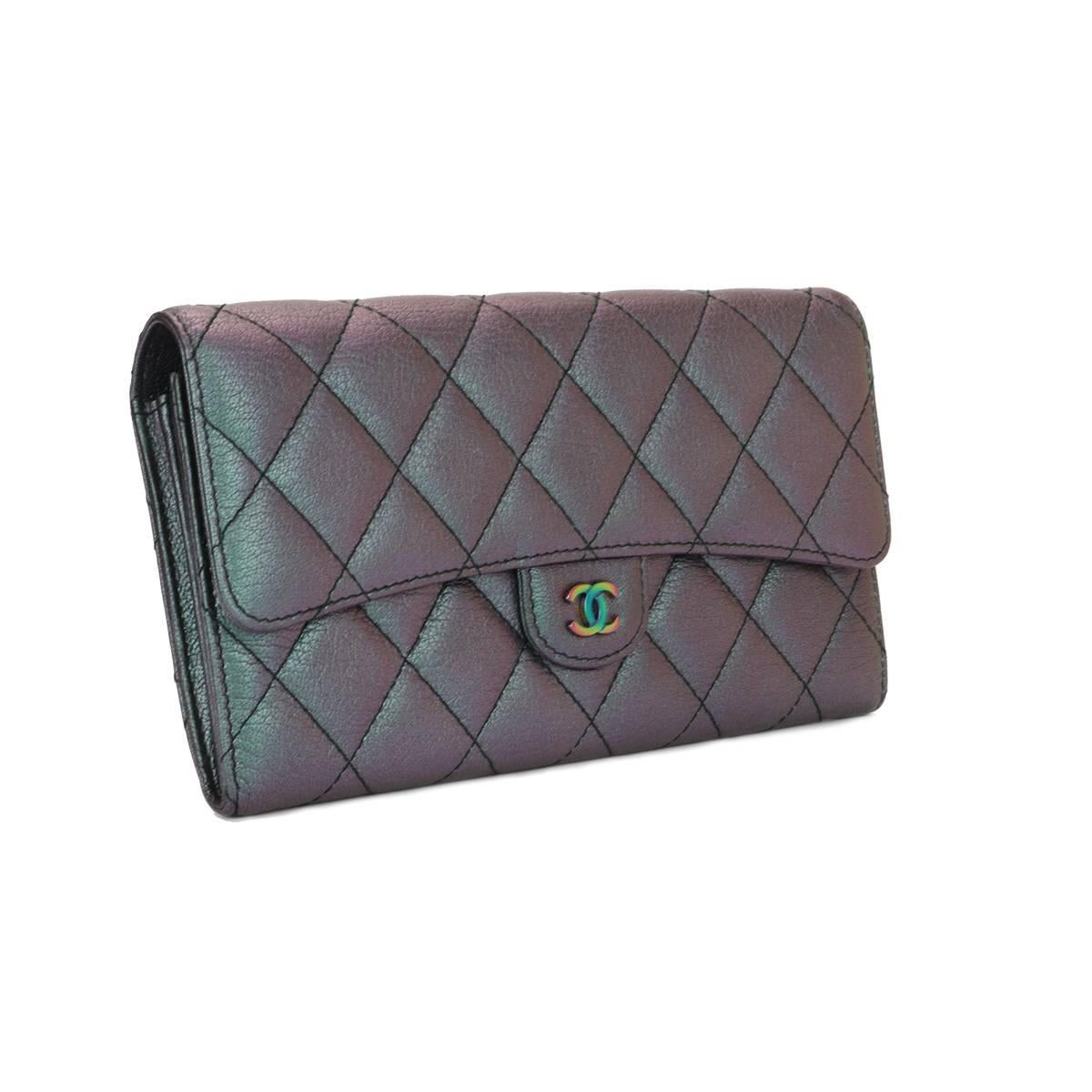 Authentic CHANEL Purple Iridescent Goatskin Flap Wallet with Rainbow Hardware 2016 LIMITED EDITION.

This stunning flap wallet is in a mint condition, it still holds its original shape, and the hardware is still very shiny. Leather smells fresh as