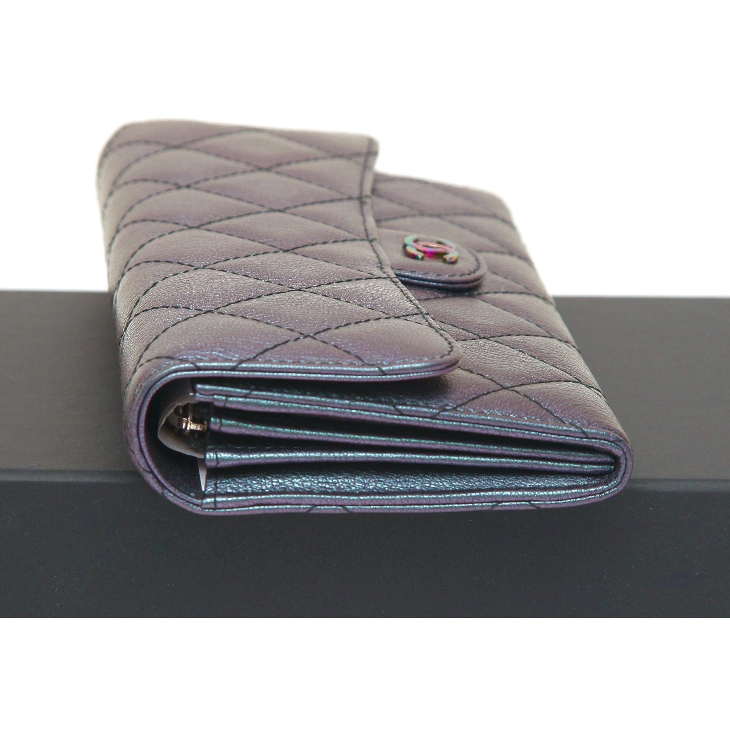 GUARANTEED AUTHENTIC CHANEL 16C PURPLE IRIDESCENT RAINBOW CC QUILTED LONG FLAP WALLET

Details:
- Chanel 16C collection purple iridescent quilted leather long flap wallet.
- Rainbow CC logo hardware.
- Holds credit cards, coins and bills.
- Plastic
