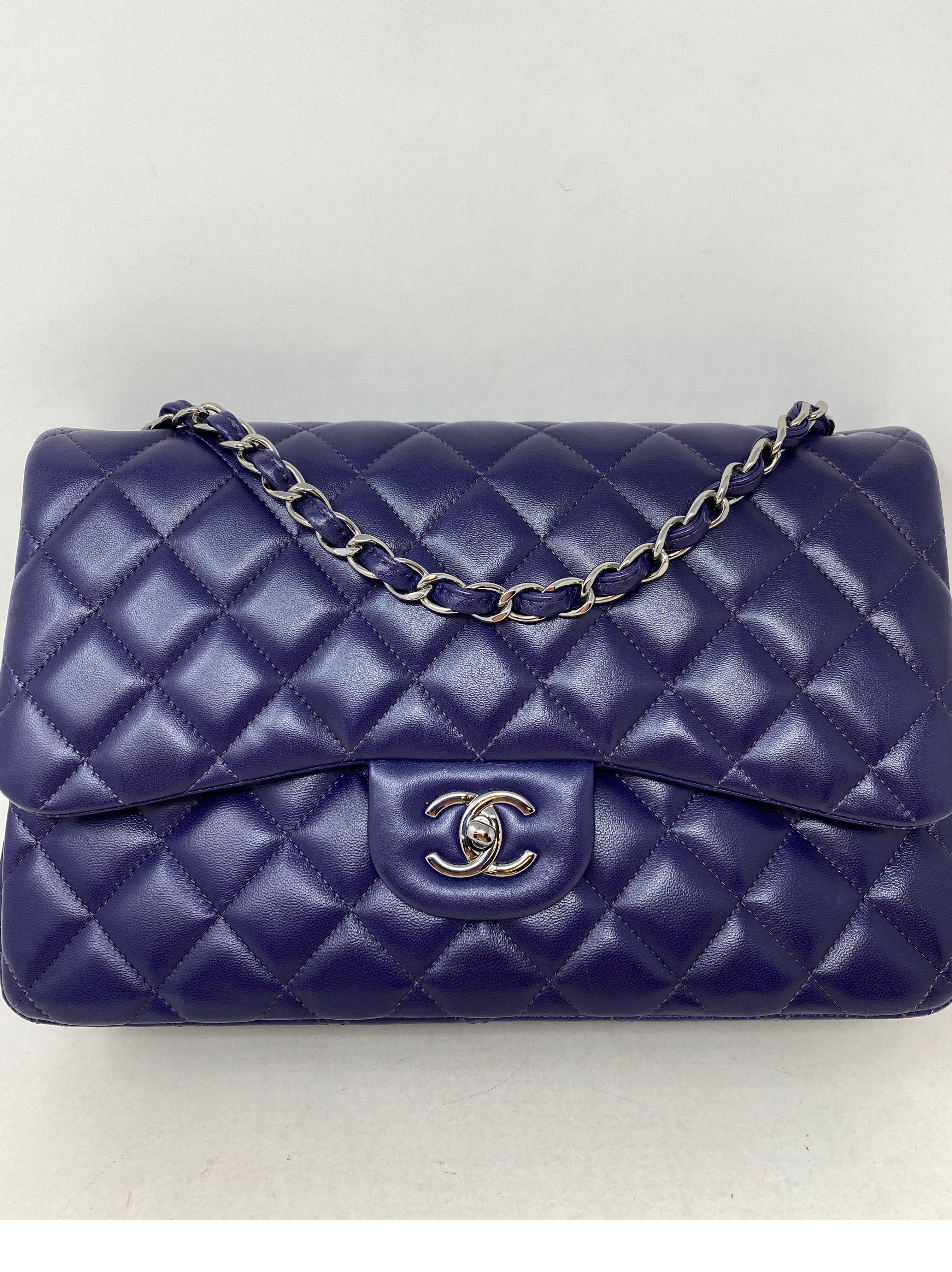 Chanel Purple Jumbo Double Flap Bag. Beautiful grape purple color. Lambskin leather Chanel. Excellent condition. Rare color and silver hardware. Can be worn as a crossbody or doubled strap as a shoulder bag. Includes full set. Authenticity card,