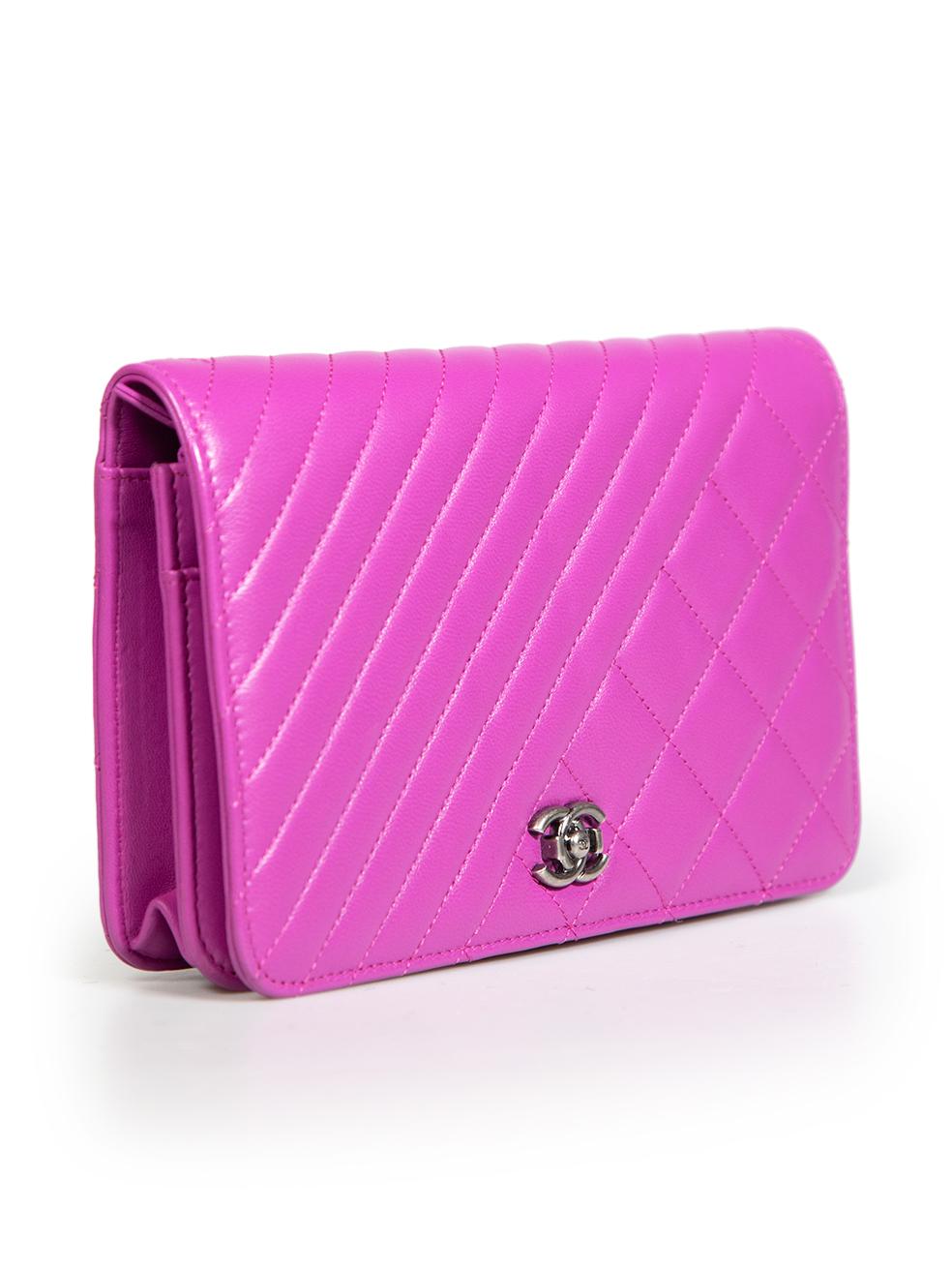 CONDITION is Very good. Minimal wear to bag is evident. Minimal indentations to the inner flap on this used Chanel designer resale item. This item comes with the original dust bag.
 
 Details
 Model: Coco Boy
 Purple
 Leather
 Mini wallet on chain
