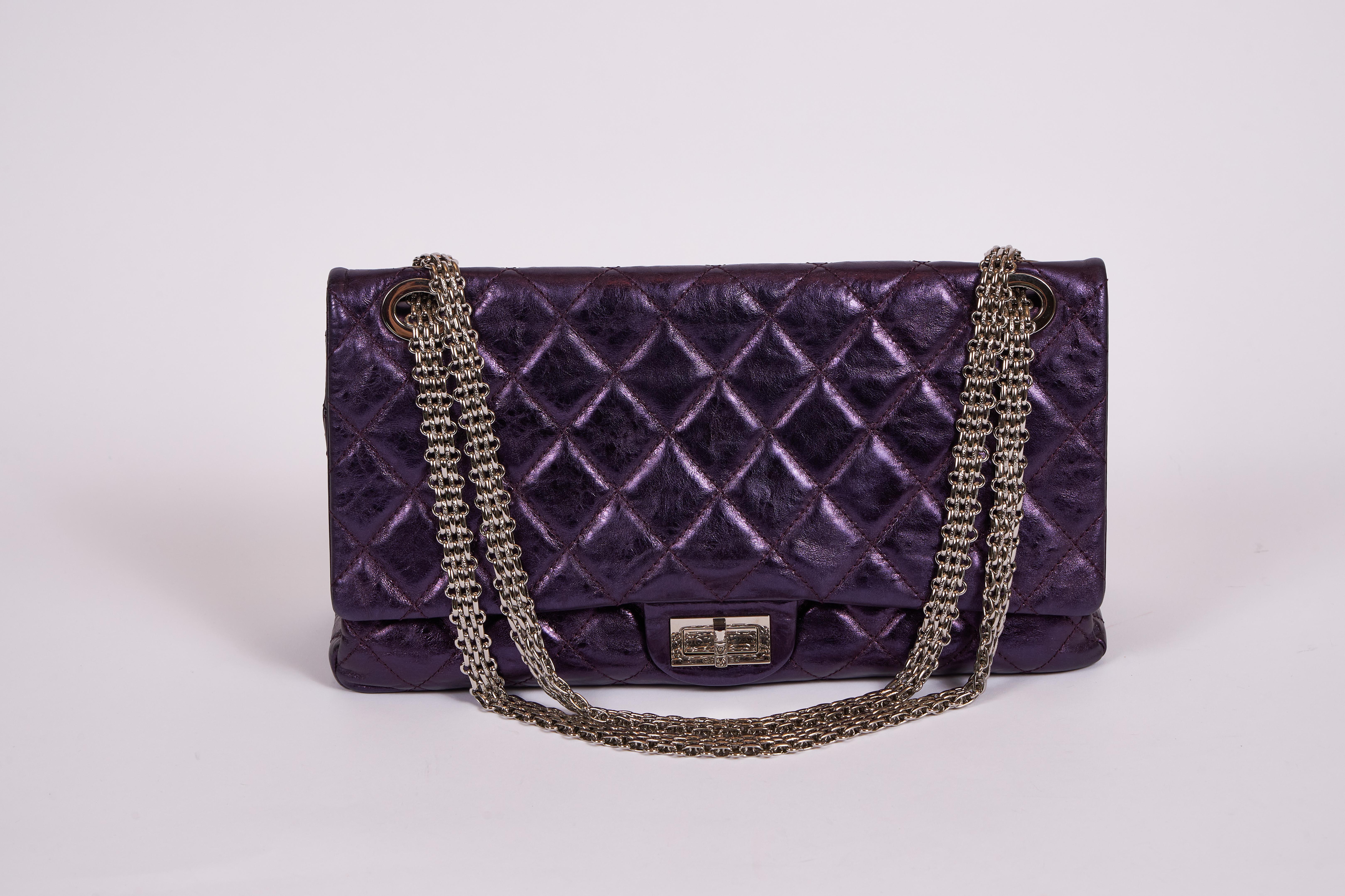 Chanel limited edition maxi reissue double flap with extra thick silver chain. Purple metallic distressed leather. Shoulder drop 10
