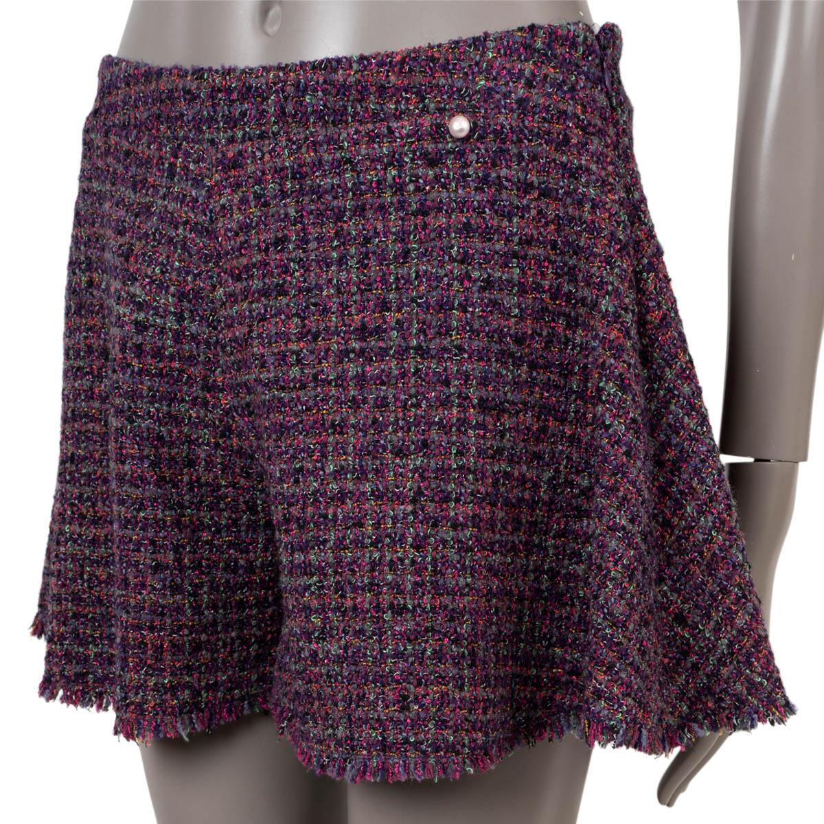 100% authentic Chanel tweed skorts in pink, purple and multicolor wool (37%), acrylic (18%), rayon (16%), polyester (15%) and nylon (14%). Feature a pearl button at the waist. Closes with a concealed zipper on the side. Lined in silk (100%). Have