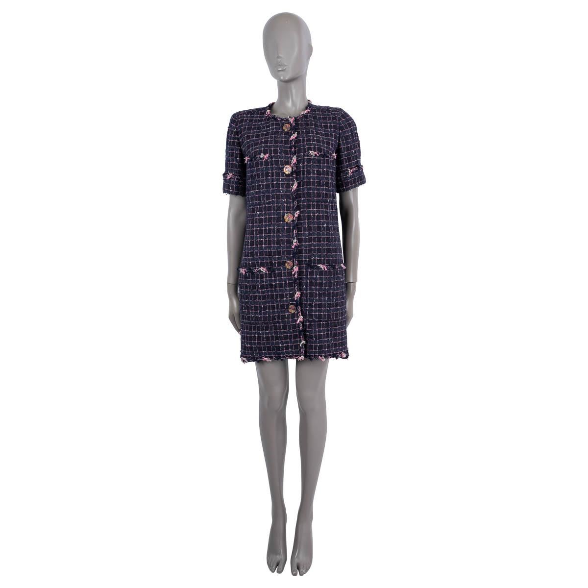 100% authentic Chanel short sleeve check tweed coat in navy blue and pink polyester (29%), acrylic (28%), cotton (19%), rayon (12%), ramie (7%) and nylon (5%). The design features a round neck, two side slits, belted back, five colorful front