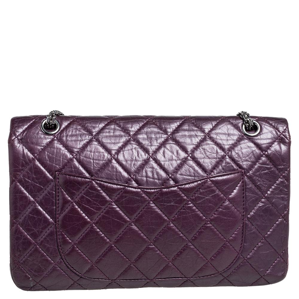 Introduce Chanel's irreplaceable style to your closet with this Reissue 2.55 Classic 227 flap bag. Crafted using aged leather, the purple bag has a signature quilted exterior, the Mademoiselle lock on the front, and a leather-lined interior.