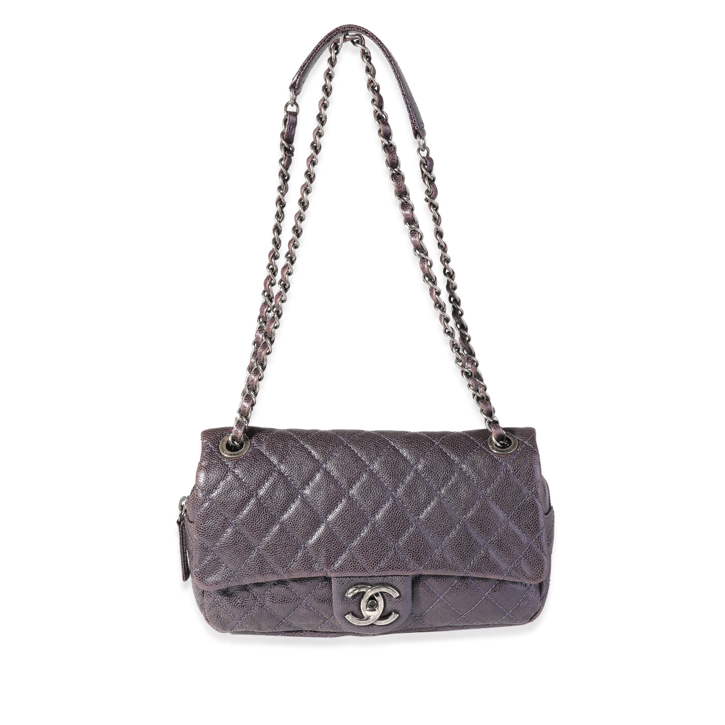 Listing Title: Chanel Purple Quilted Caviar Easy Flap Bag
SKU: 119571
Condition: Pre-owned (3000)
Handbag Condition: Good
Condition Comments: Good Condition. Moderate discoloration to exterior throughout. Wear to corners. Faint discoloration to