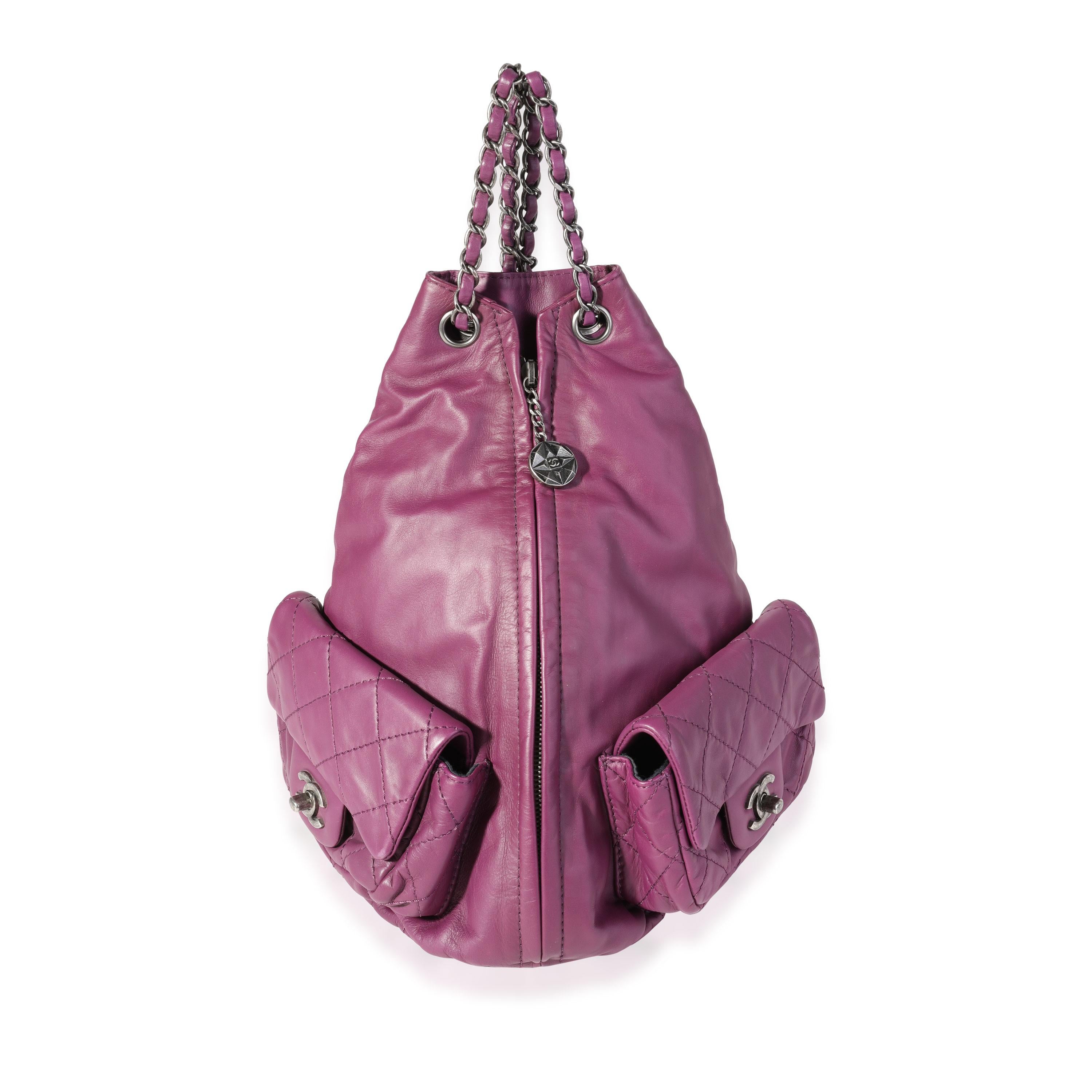 Listing Title: Chanel Purple Quilted Lambskin Backpack Is Back
SKU: 120644
Condition: Pre-owned 
Handbag Condition: Very Good
Condition Comments: Very Good Condition. Light creasing to leather.
Brand: Chanel
Model: Backpack Is Back
Origin Country: