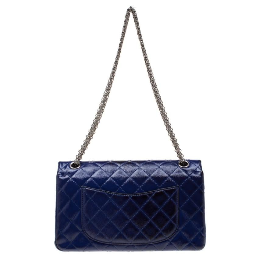 Chanel's Flap Bags are iconic and monumental in the history of fashion. This Reissue 2.55 Classic 226 is a buy that is worth every bit of your splurge. Exquisitely crafted from purple leather, it bears their signature quilt pattern and the iconic