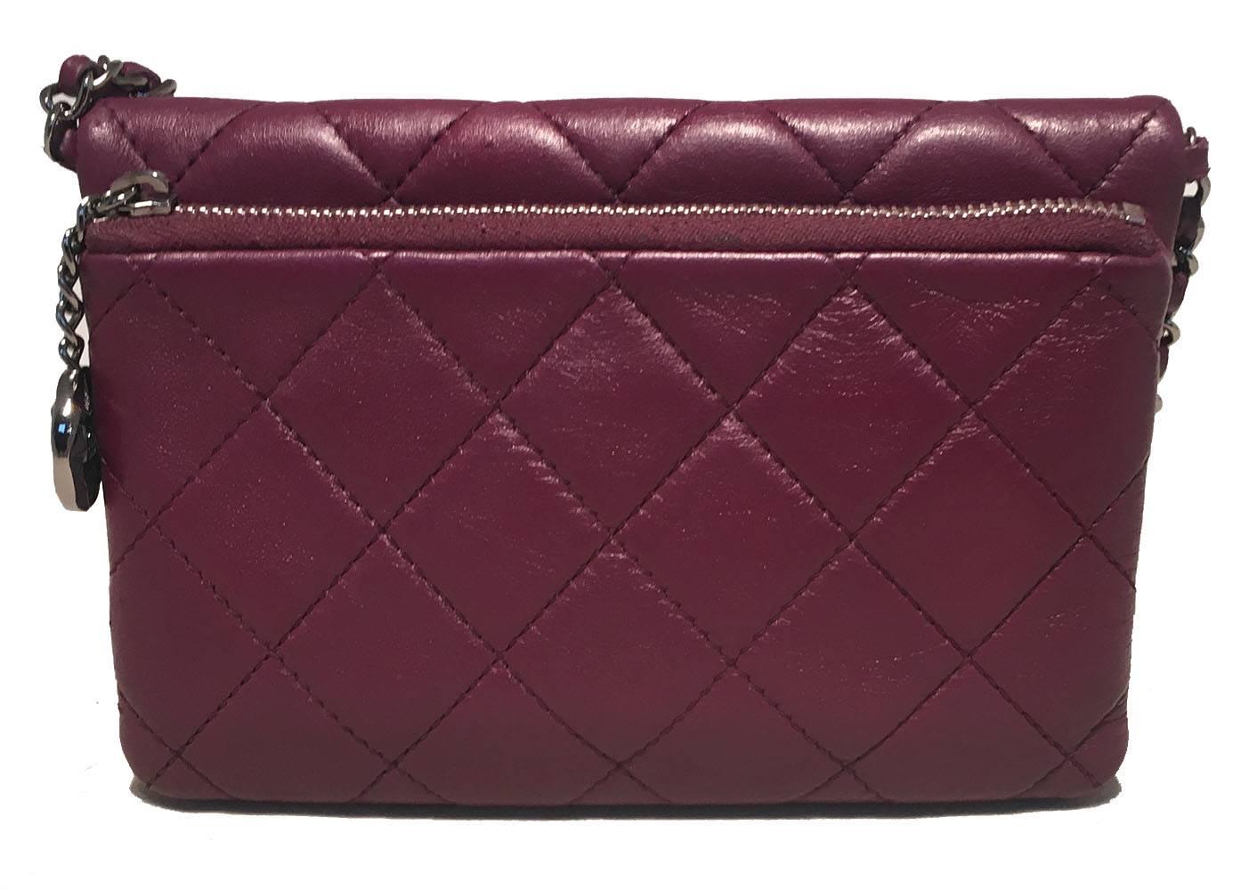 FABULOUS Chanel Purple leather wallet on a chain WOC classic in excellent condition.  Purple quilted lambskin leather exterior trimmed with shinning silver hardware.  Woven chain and leather shoulder strap can be worn as a shoulder bag or crossbody