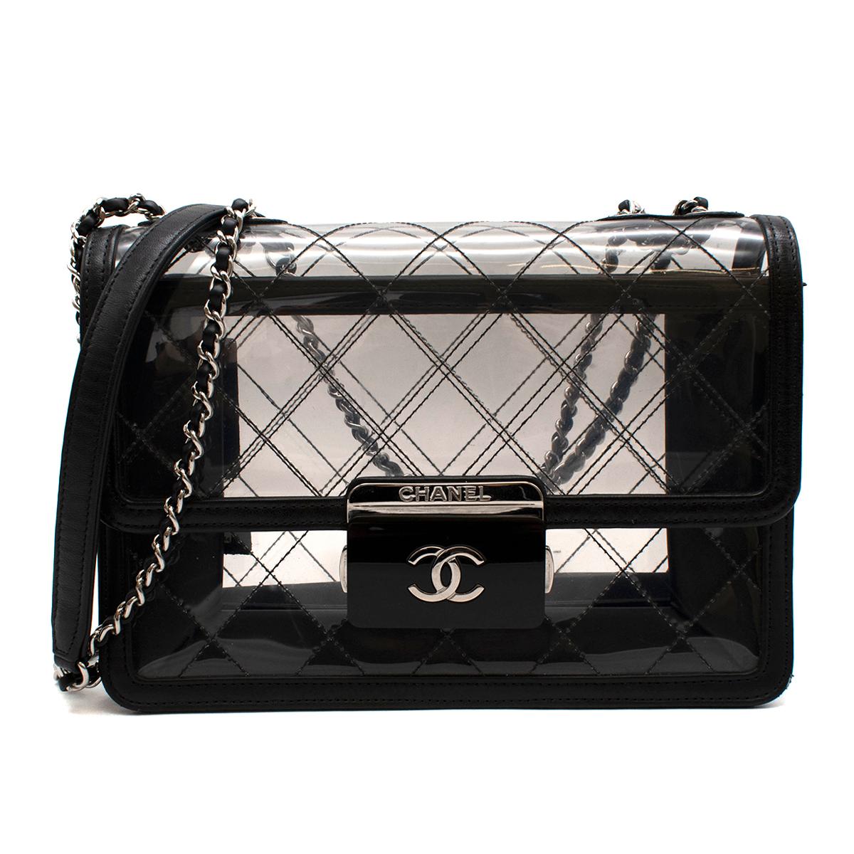 Chanel PVC Lambskin Quilted Lock Flap Bag

- Slim Silver-tone hardware chain
- Diamond stitched outer 
- Black Resin Square closure with silver tone CC
- Two internal compartments 
- Original dust-bag and box included 

Made in Italy 

length: