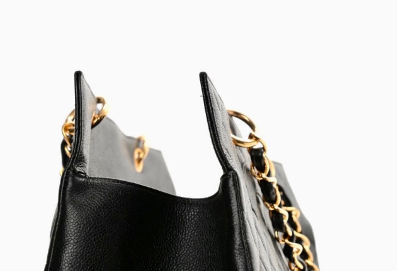 Chanel Quilted Black Caviar Skin Grand Shopper Chain Tote, Golden Hardware
Chanel’s Grand Shopping Tote comes in durable black caviar leather and features Gold hardware,
This stylish tote is crafted of diamond quilted caviar leather in black. This