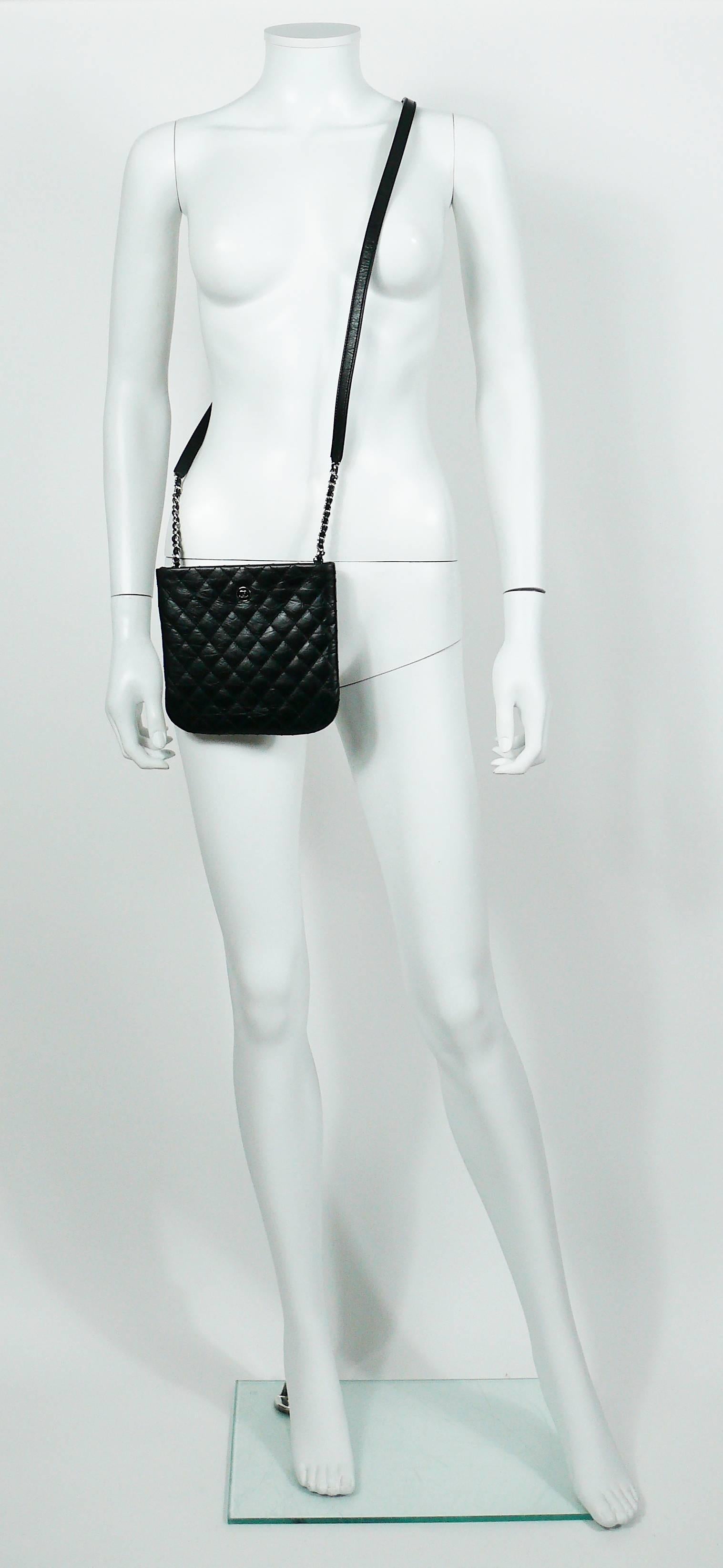 CHANEL UNIFORM quilted black leather crossbody bag.

Please note this item was original part of a CHANEL employee uniform.

This bag features :
- Quilted black leather exterior.
- Silver toned with black enamel coin detail with CC logo.
- Silver