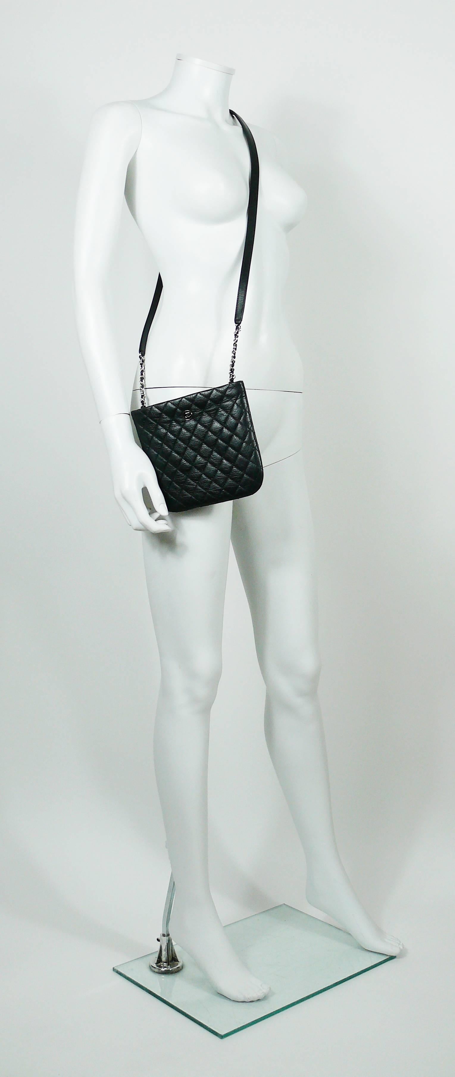 CHANEL UNIFORM quilted black leather crossbody bag.

Please note this item was original part of a CHANEL employee uniform.

This bag features :
- Quilted black leather exterior.
- Silver toned with black enamel coin detail with CC logo.
- Silver