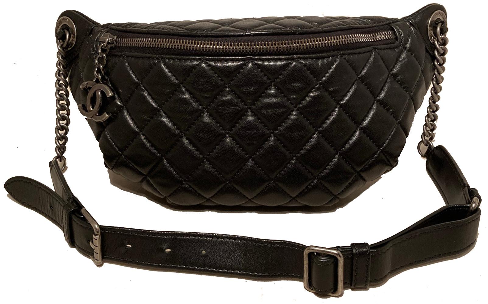Chanel Quilted Black Leather Banane Fanny Pack Bum Bag in excellent like new condition. Black quilted lambskin exterior trimmed with ruthenium hardware. Thick chain and leather strap buckle can easily be worn at a variety of lengths to suit waist,
