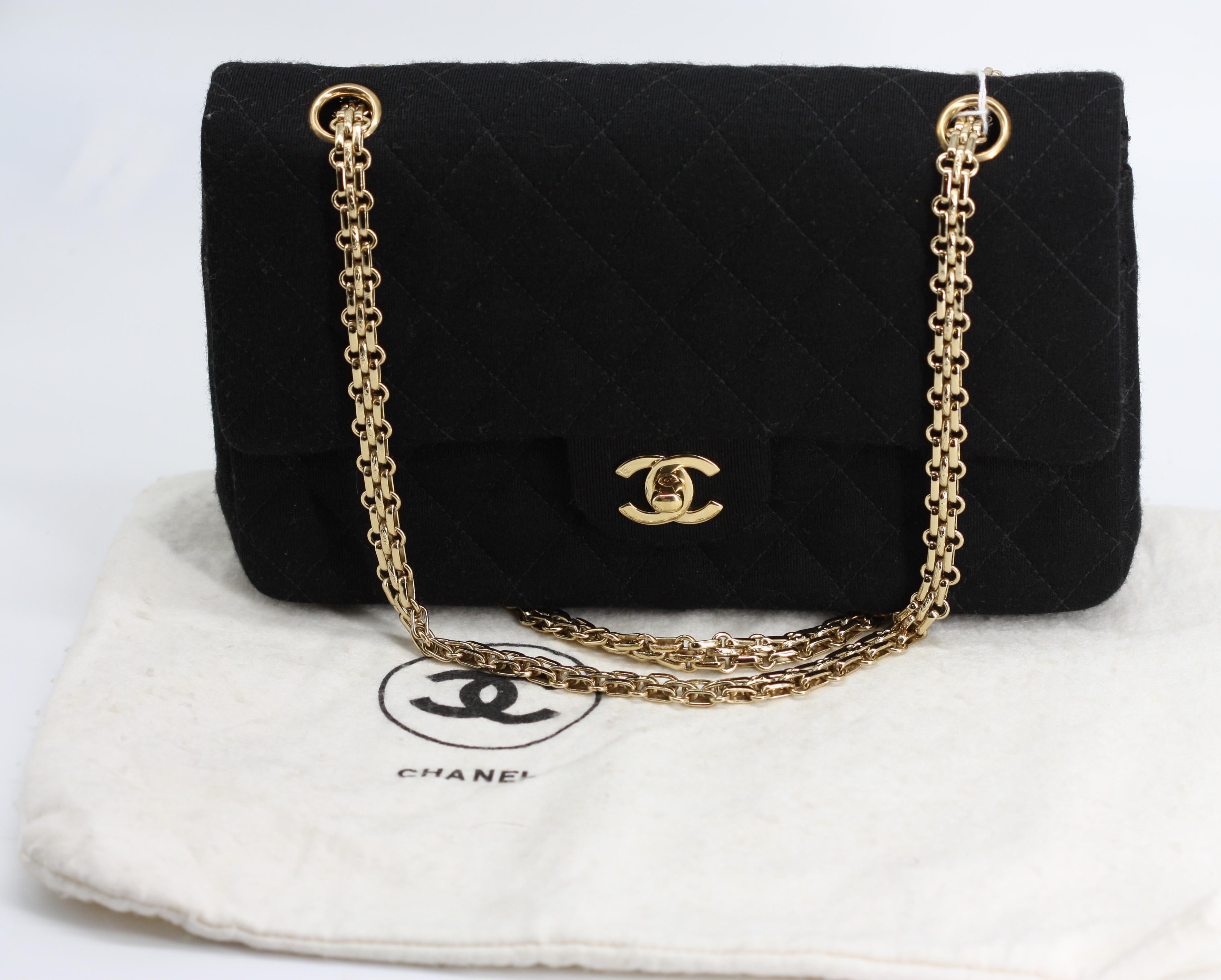 
Chanel Quilted Black Wool Double-Flap Handbag
Signed, with Carte D Authenticite 6929532. Gold toned hardware, double looped shoulder chain, interlaced C clasp, the reverse with a open sleeve, the underside of the exterior flap with zipper sleeve,