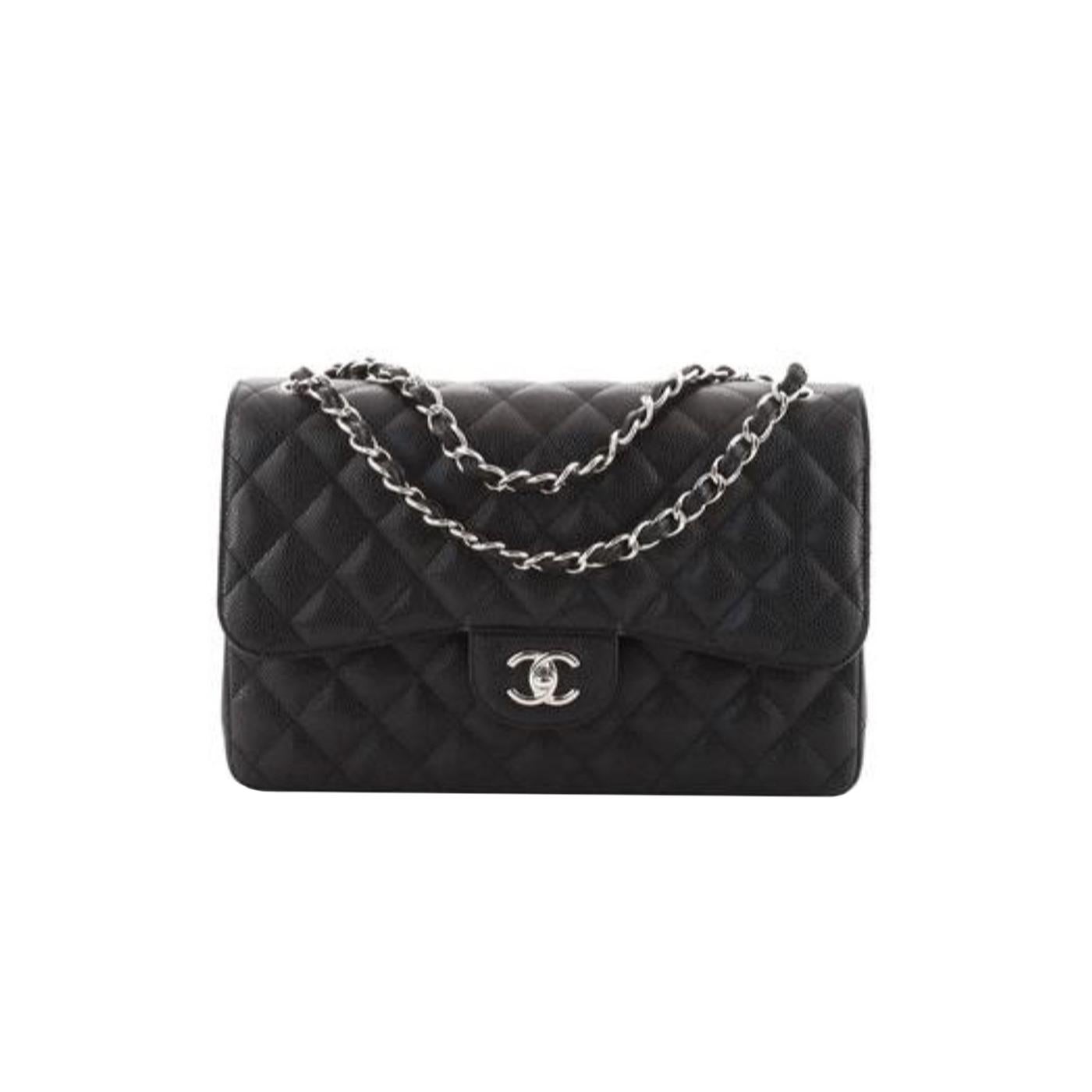 This Jumbo Classic Double Flap bag is in black caviar leather with silver-tone hardware and features a front flap with signature CC turn-lock closure, and adjustable interwoven silver-tone chain link, and a black leather shoulder