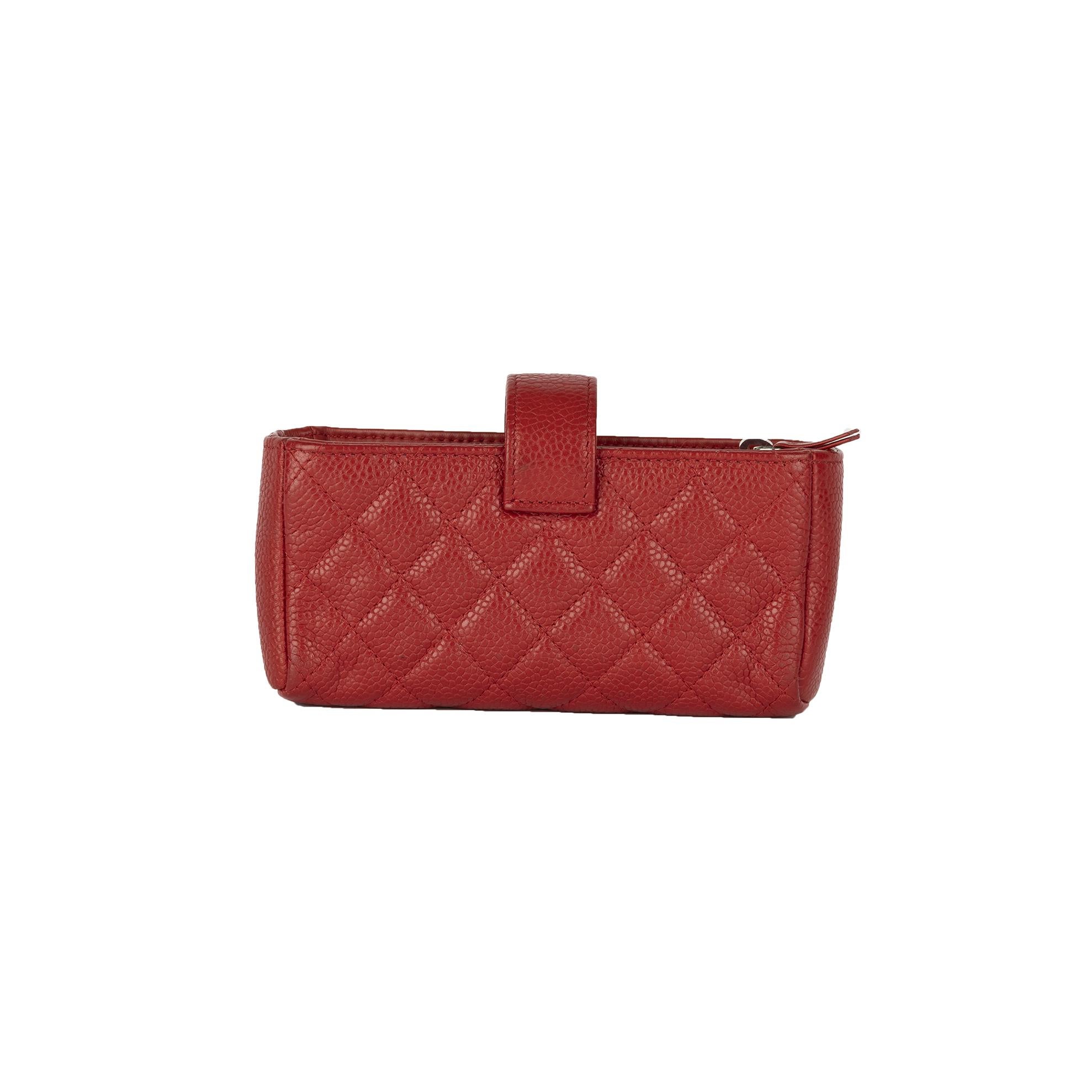 Crafted with red quilted leather, the Chanel phone holder is both versatile and aesthetic. With silver-toned metal hardware accentuating the exterior of the pouch, the suede interior makes the pouch look more refined.

Inclusion: box, dust bag.