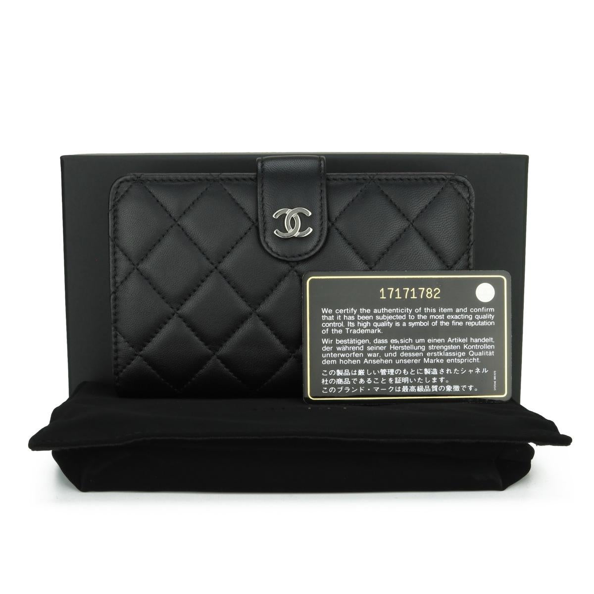 Chanel Quilted Bifold Classic Zipped Pocket Medium Wallet Black Lambskin with Silver Hardware 2013.

This stunning classic wallet is in very good condition, the wallet still holds its original shape, and the hardware is still very shiny.

- Exterior